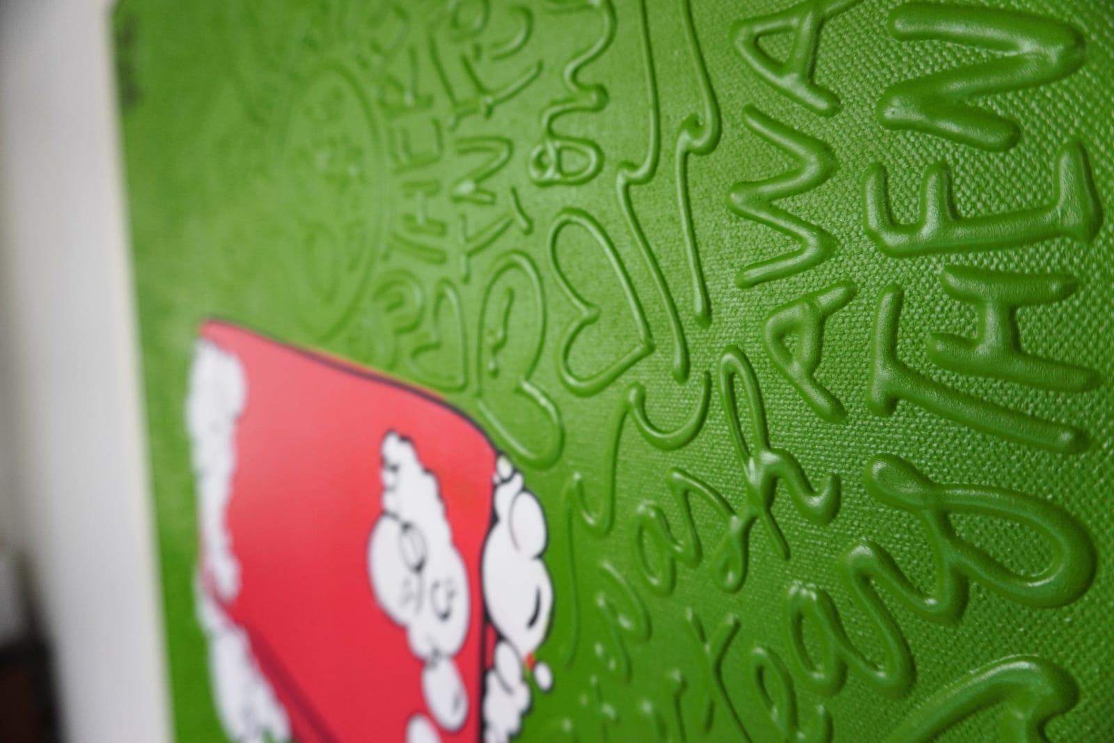 Detail photo of “El Fight Club”, painting by Cayla Birk artist from South Florida. Available at Carousel Fine Art Chicago. The artist’s technique blends traditional acrylic paints with unique materials, creating a distinct mixed media style. Birk's work is marked by intricate designs and recognizable gestures, combining contemporary culture, history, music, and literature. Her art challenges conventional thinking, offering new and unexpected experiences. Colors of this work : Green, Red, Beige, White, Black