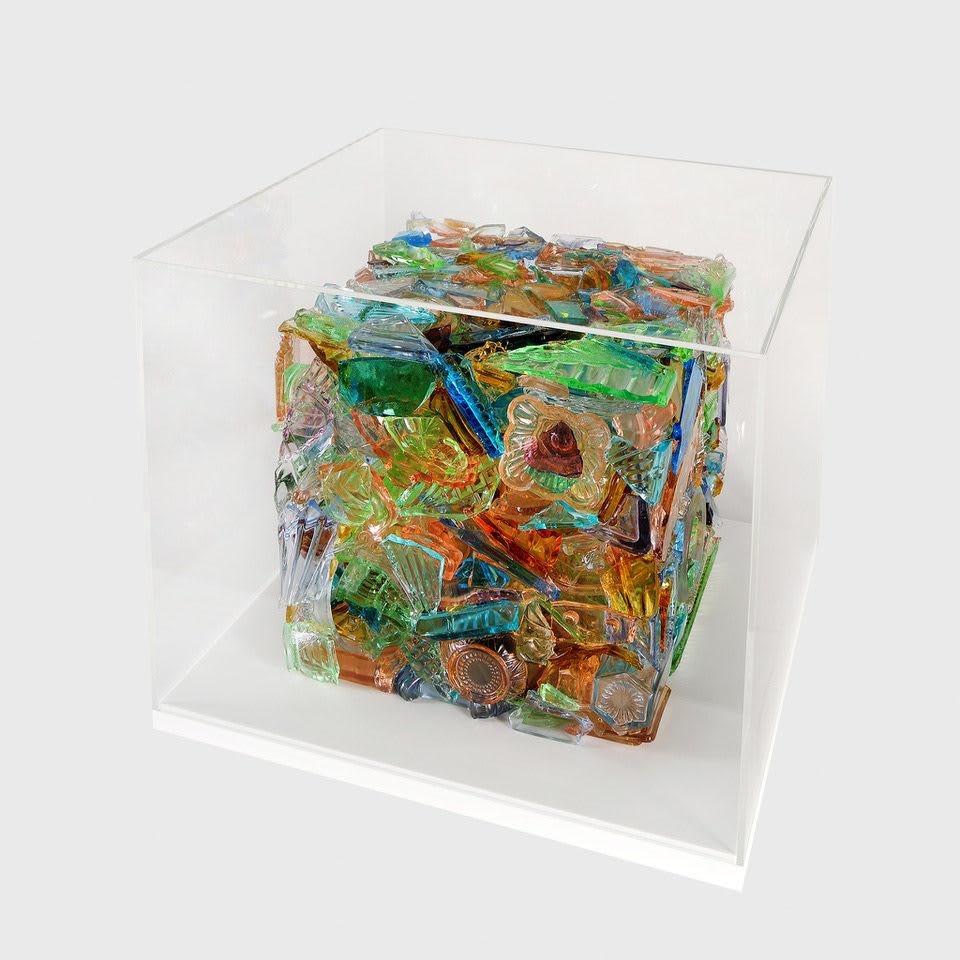 “I Have A Little Crush”, sculpture by Sandra Sashou. Sculpture is made from reassembled broken pieces of glass that are Art Deco Vanity Sets. The multicolor glass appears almost as sea glass with vibrant colors of green, lime green, turquoise, orange, cerulean and light rosy pink. Available at Carousel Fine Art Miami.