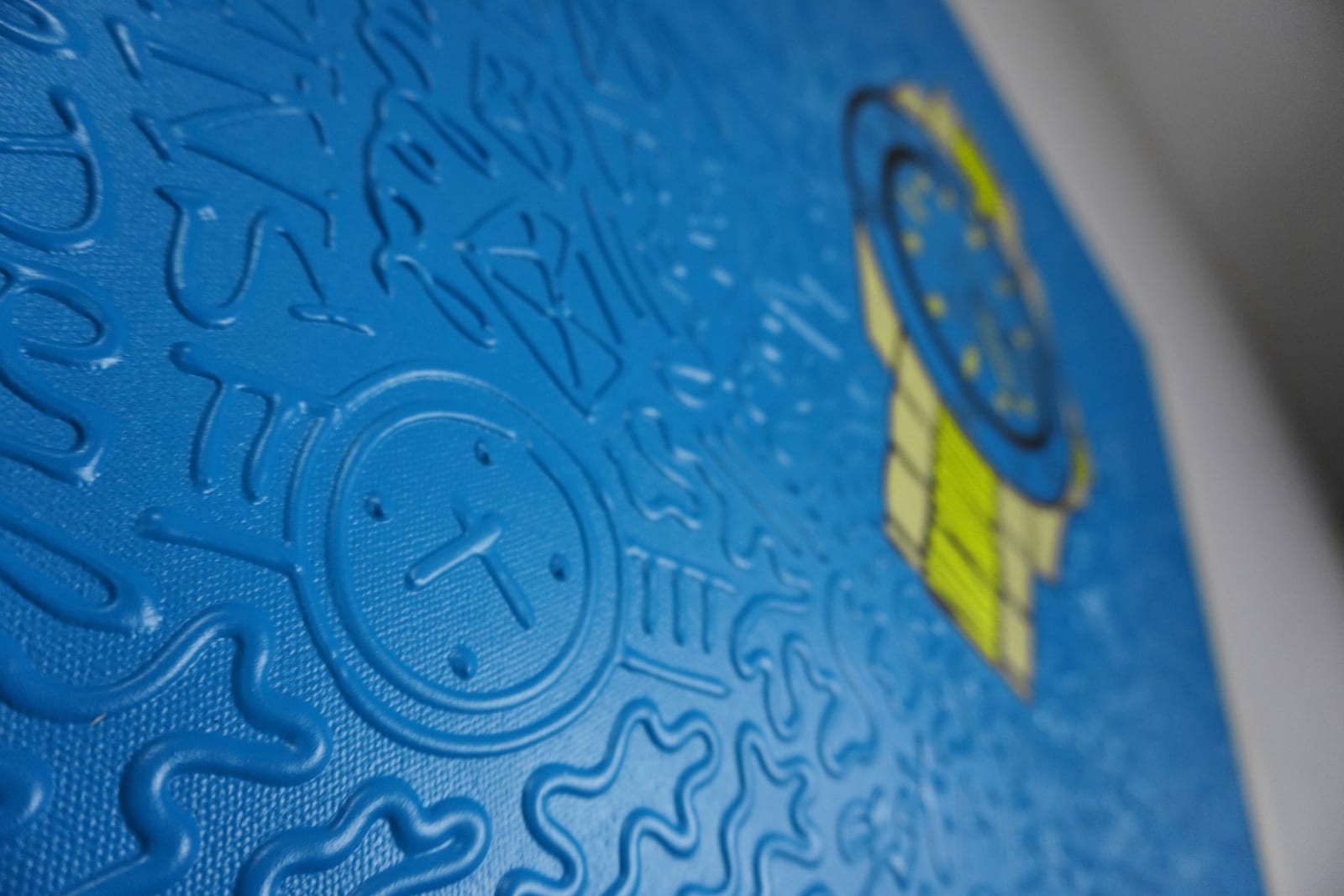 Detail photo of “El Reloj”, painting by Cayla Birk artist from South Florida. Available at Carousel Fine Art Chicago. The artist’s technique blends traditional acrylic paints with unique materials, creating a distinct mixed media style. Birk's work is marked by intricate designs and recognizable gestures, combining contemporary culture, history, music, and literature. Her art challenges conventional thinking, offering new and unexpected experiences. Colors of this work : Blue, Yellow, Beige, Black
