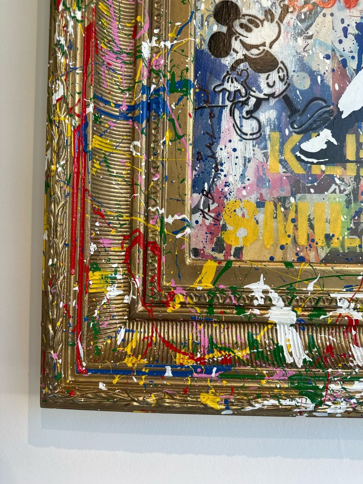 Detail photo of “Banksy Thrower”, mixed media by Mr. Brainwash artist from France, based in L.A. Available at Carousel Fine Art Chicago. The artist’s technique uses stencils to create subjects like Einstein, chimpanzees, and Charlie Chaplin. He then adds color sketches and writings, including the motto Life is Beautiful. His work blends pop art's history with the raw energy of street art. Colors of this work : Blue, Red, Pink, Yellow, Orange, Green, Pink, Beige, Grey, White, Black