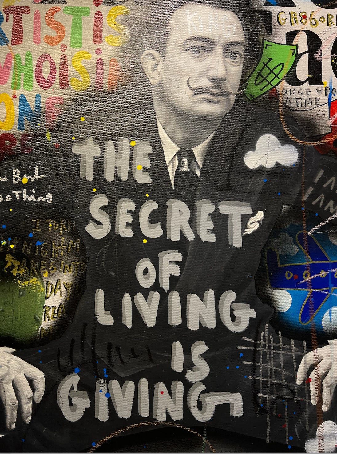 Detail photo of Bulls and Dali”, mixed media work by Jisbar artist from France, based in Portugal. Available at Carousel Fine Art Chicago. The artist’s hyper-saturated works blend Pop art with cultural references from fashion, music, and street art. He is known for his colorful, cryptic reinterpretations of iconic art history figures in mixed media on canvas. Colors of this work : Blue, Green, Teal, Red, Burgundy, Pink, Yellow, Purple, Black, Orange, Grey, White