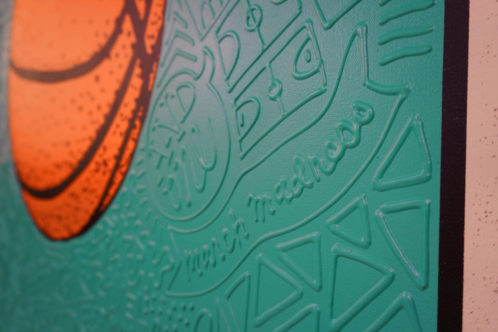 Detail photo of “El Balón”, painting by Cayla Birk artist from South Florida. Available at Carousel Fine Art Chicago. The artist’s technique blends traditional acrylic paints with unique materials, creating a distinct mixed media style. Birk's work is marked by intricate designs and recognizable gestures, combining contemporary culture, history, music, and literature. Her art challenges conventional thinking, offering new and unexpected experiences. Colors of this work : Teal, Orange, Beige, Black