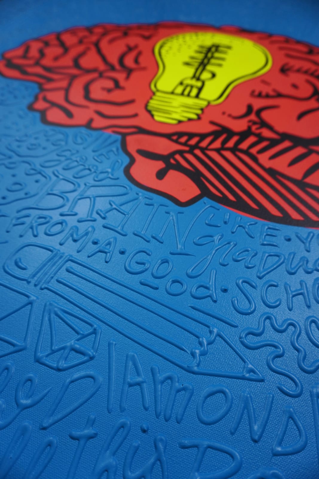 Detail photo of “La Mente”, painting by Cayla Birk artist from South Florida. Available at Carousel Fine Art Chicago. The artist’s technique blends traditional acrylic paints with unique materials, creating a distinct mixed media style. Birk's work is marked by intricate designs and recognizable gestures, combining contemporary culture, history, music, and literature. Her art challenges conventional thinking, offering new and unexpected experiences. Colors of this work : Red, Blue, Yellow, Beige, Black