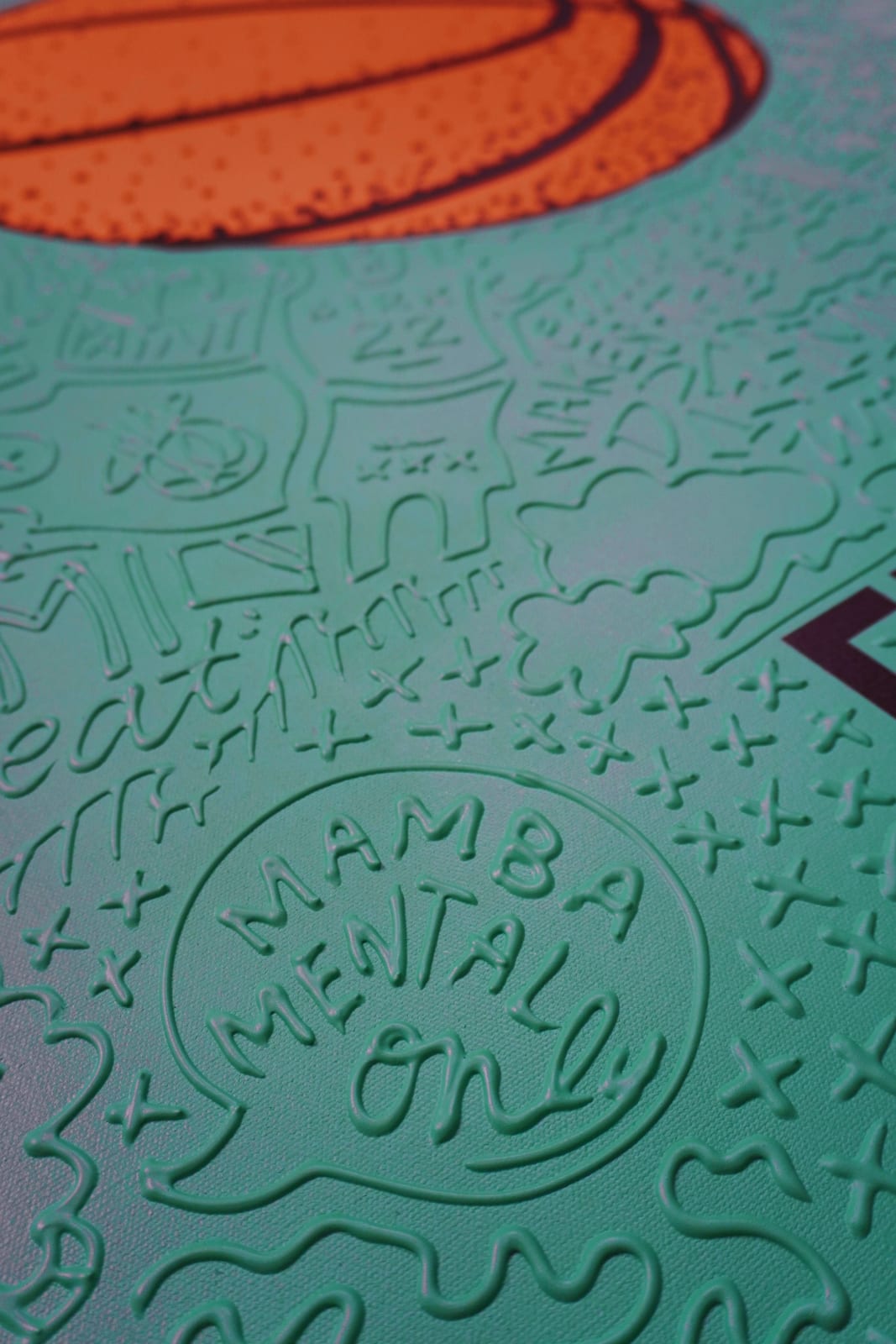 Detail photo of “El Balón”, painting by Cayla Birk artist from South Florida. Available at Carousel Fine Art Chicago. The artist’s technique blends traditional acrylic paints with unique materials, creating a distinct mixed media style. Birk's work is marked by intricate designs and recognizable gestures, combining contemporary culture, history, music, and literature. Her art challenges conventional thinking, offering new and unexpected experiences. Colors of this work : Teal, Orange, Beige, Black