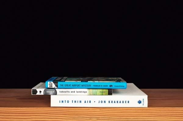 Nina Katchadourian, The Great Airport Mystery from the series Family Gathering, 2013 ("Sorted Books" project, 1993-ongoing), 2013