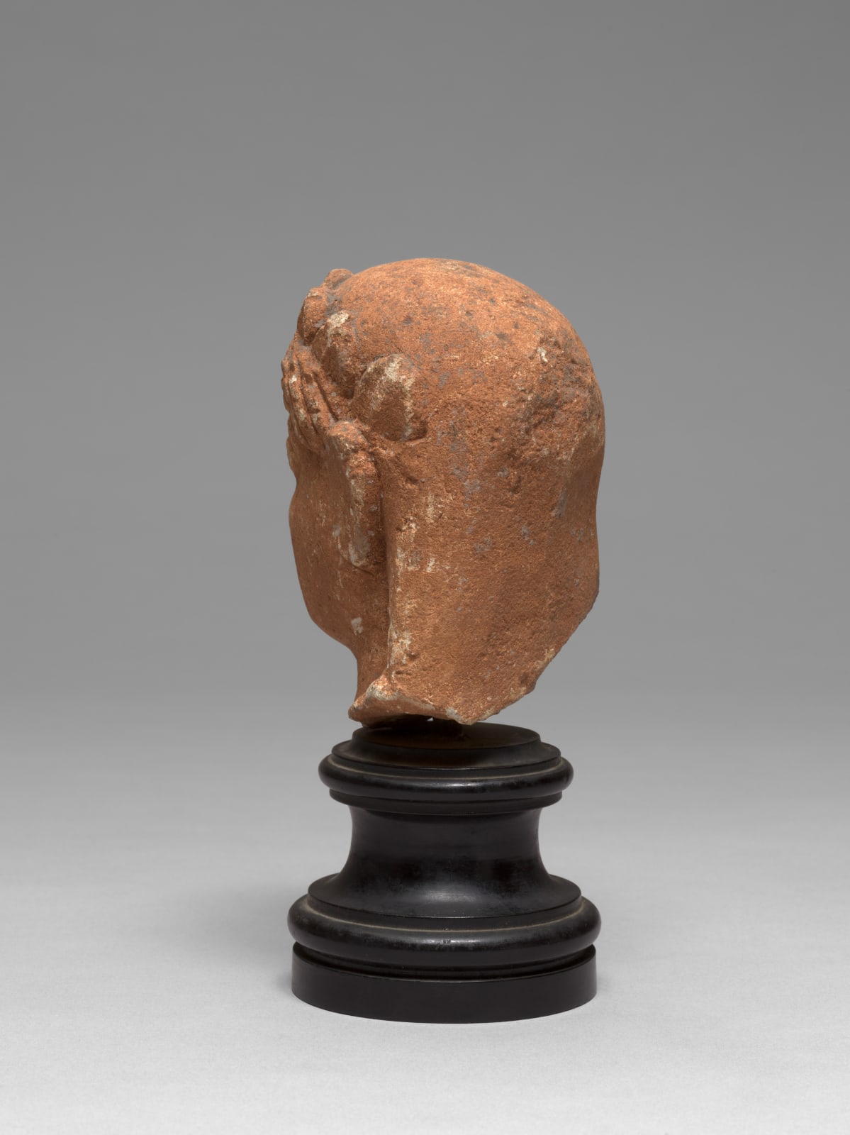 CYPRIOT HEAD OF A VOTARY, Archaic Period, circa late 6th-early 5th Century B.C.