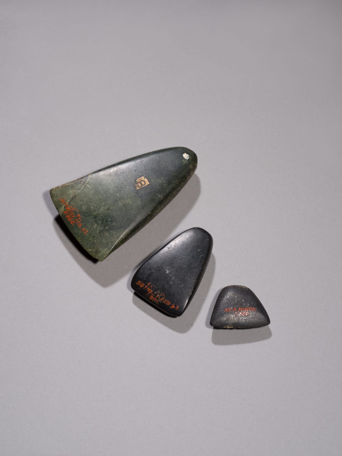 THREE POLISHED STONE AXE HEADS, Asia Minor, Bronze Age