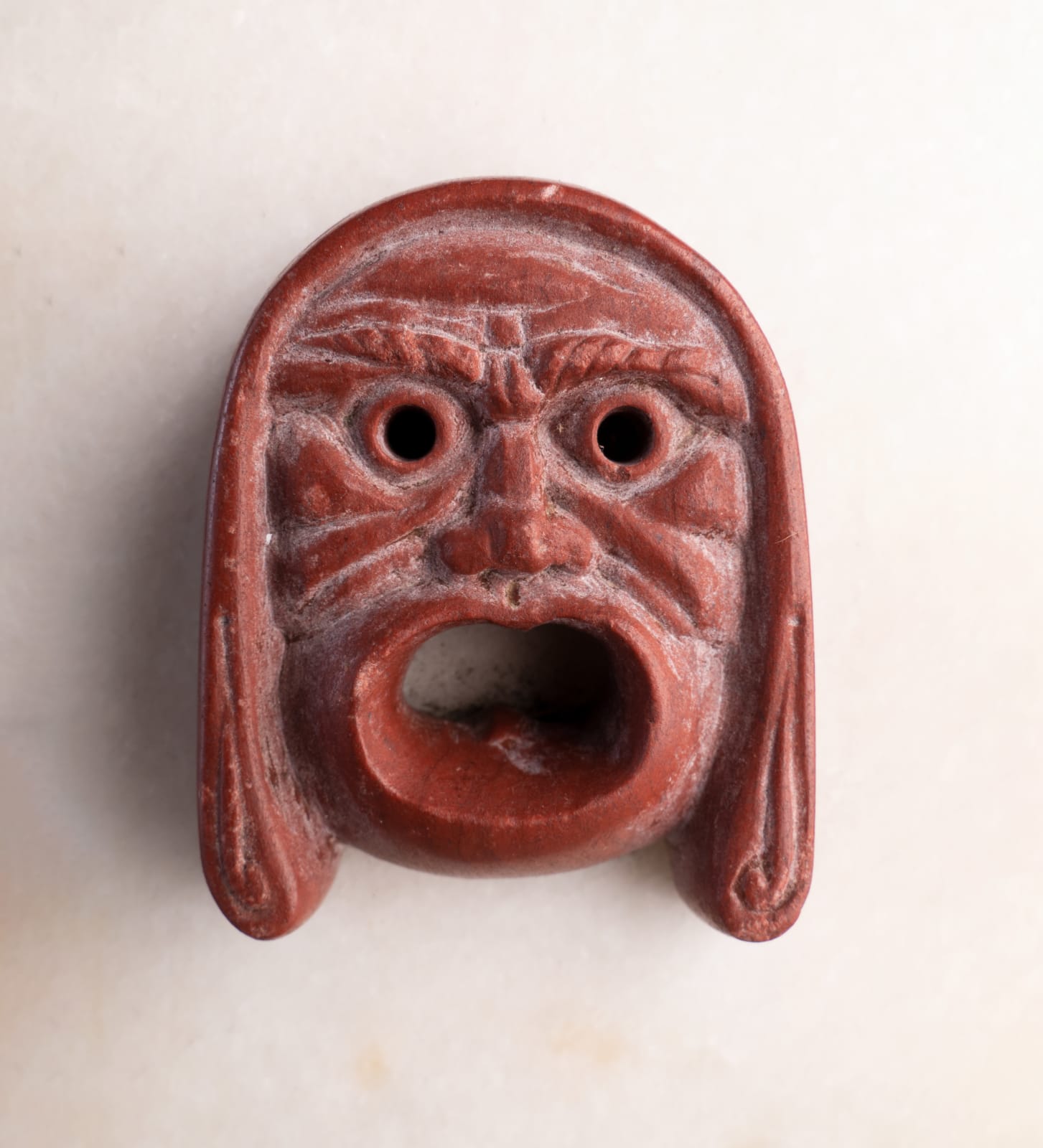 ROSSO ANTICO THEATRICAL MASK, Roman Empire, 1st Century A.D.
