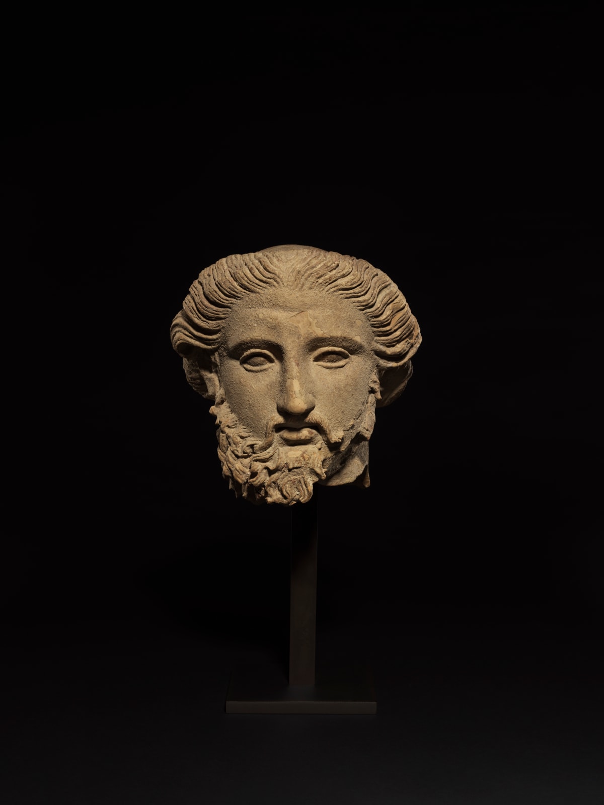 SOUTH ITALIAN GREEK, Fragmentary Head of a Bearded God, South Italian Greek, c. 4th century BC