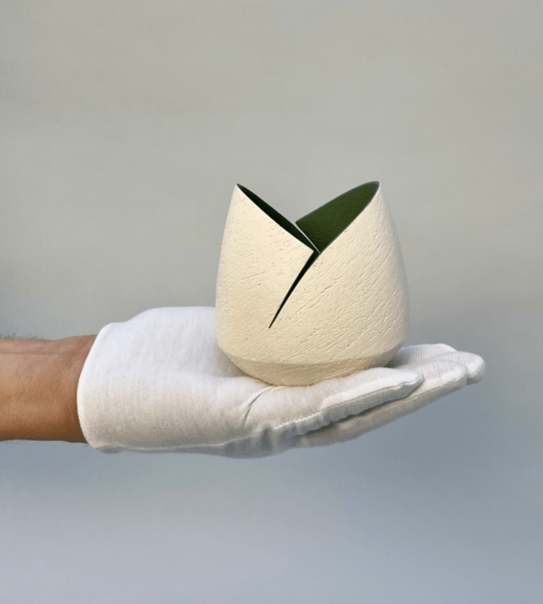 Ashraf Hanna, Ivory cut and altered pinch pot with dark sage interior