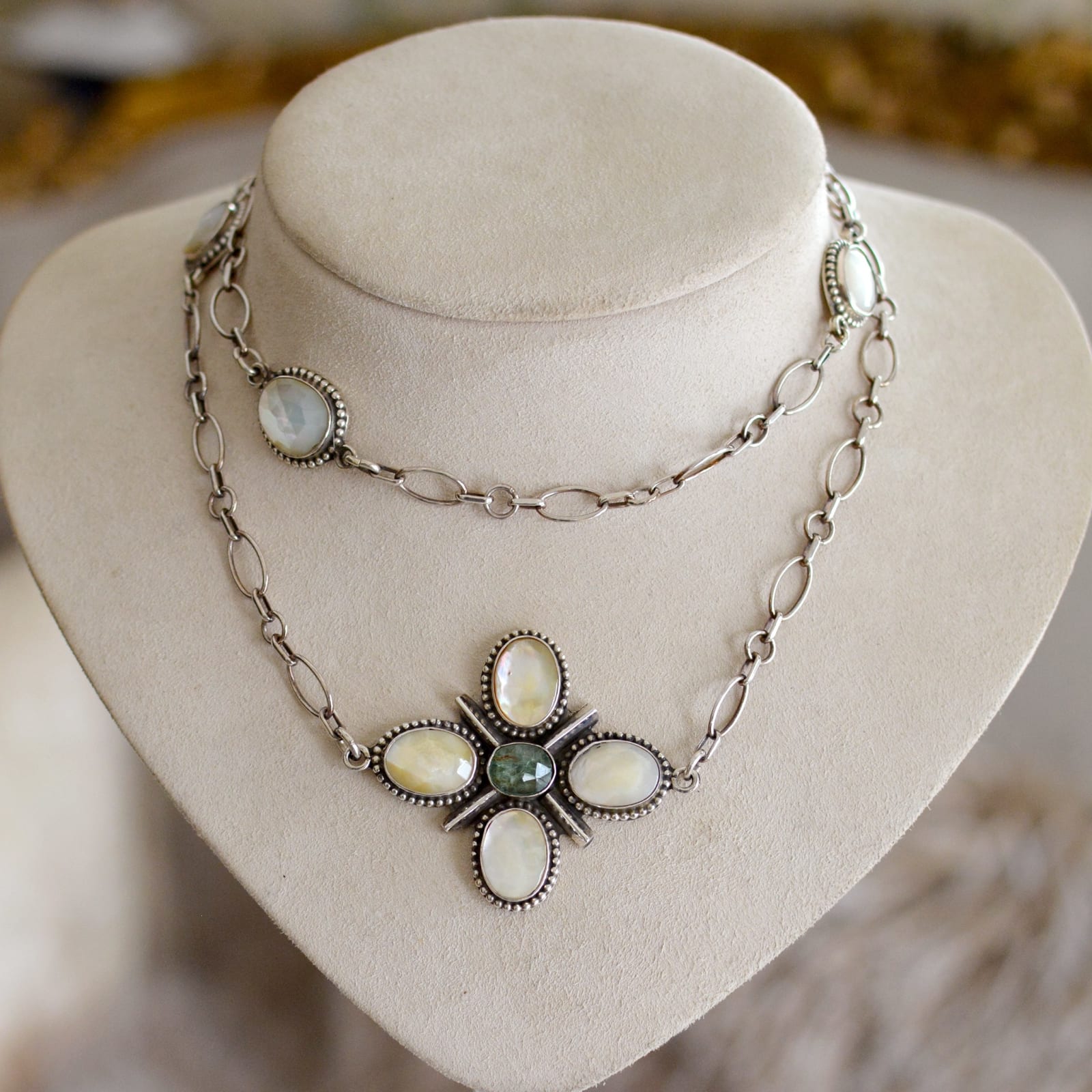 Jill Garber, Original design as an off-center cross necklace contained within her complex multi-link sterling silver chain