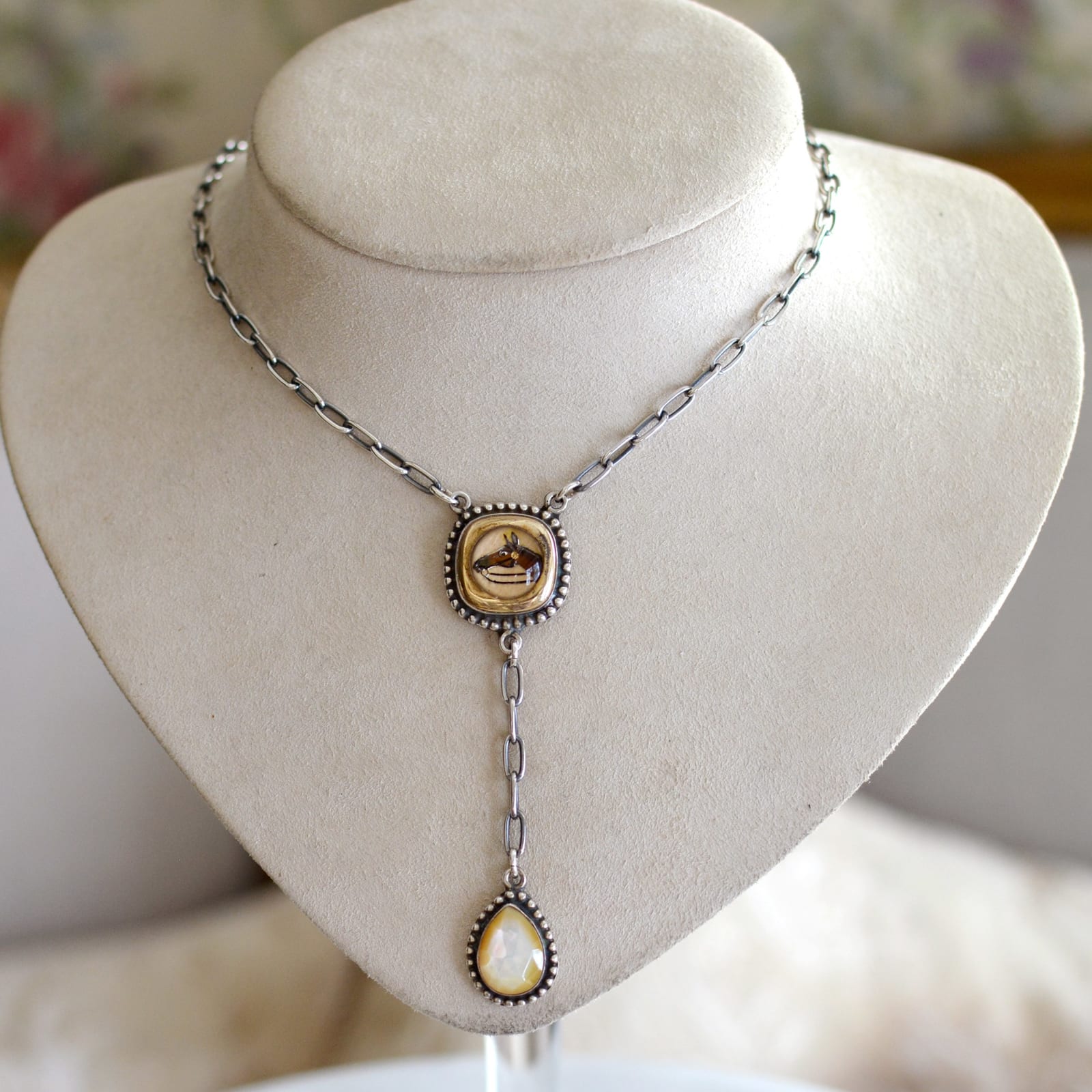 Jill Garber, A lovely lingerie necklace comprised of an original early 20th Century English intaglio depicting a horses head rendered in shades of brown, and black, reverse painted within crystal