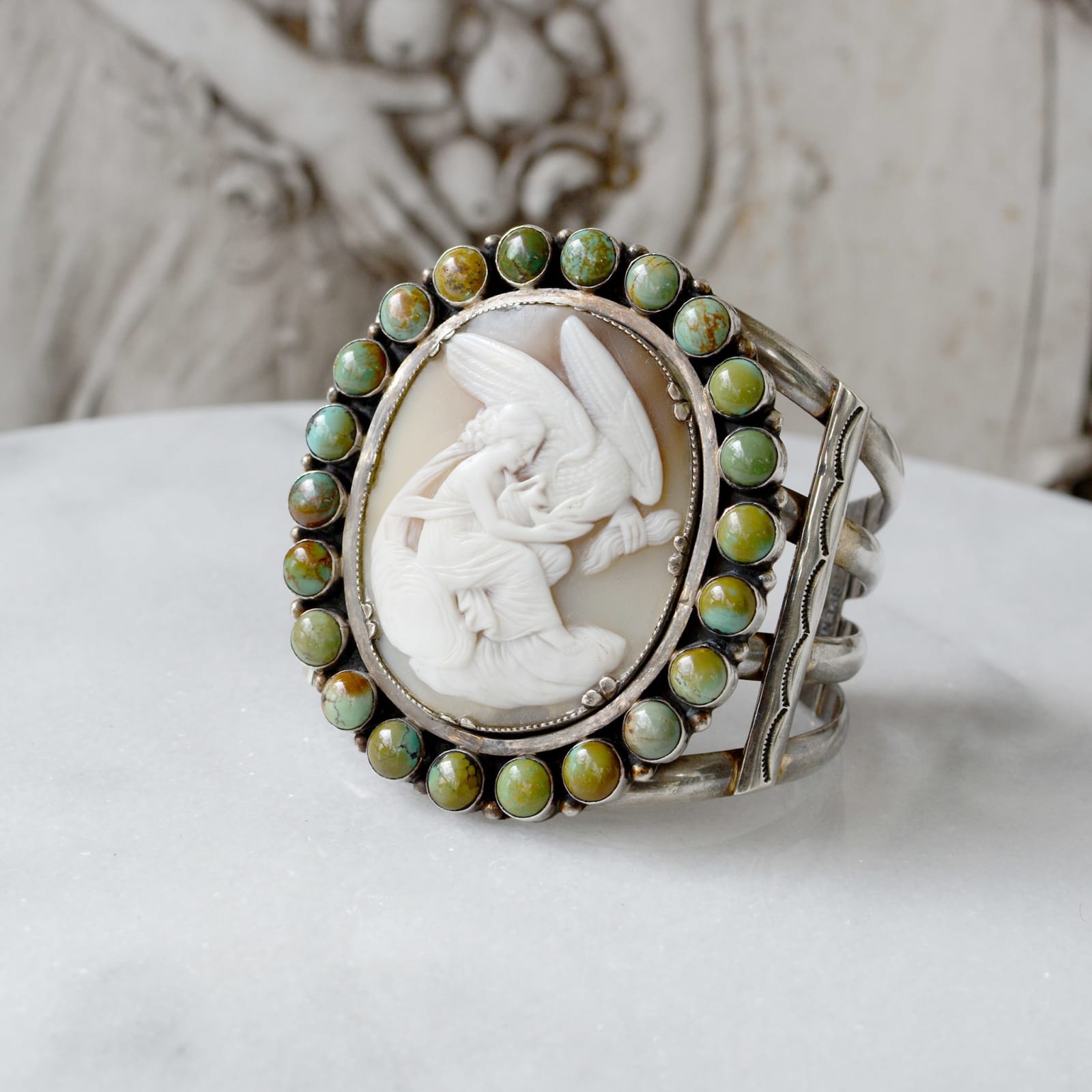 Jill Garber, Very fine 19th Century hand carved cameo depicting leda and the swan cameo surrounded with rosemary green Royston turquoise cabochons