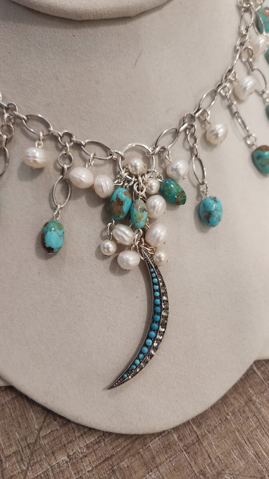 Jill Garber, A lovely array of kingman turquoise and baroque freshwater pearl necklace elaborately festoon from Jill’s unique Italian, sterling silver chain links