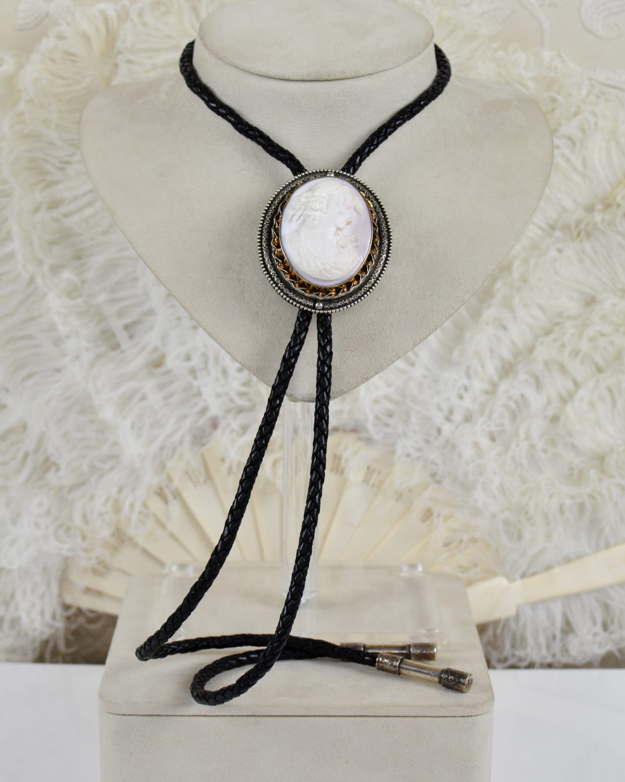 Jill Garber, THIS LOVELY HIGH RELIEF HAND CARVED CAMEO DEPICTING A VENETIAN GODDESS IS MOUNTED WITHIN A MULTI LAYERED 14 KARAT GOLD WITH STERLING SILVER FRAME.