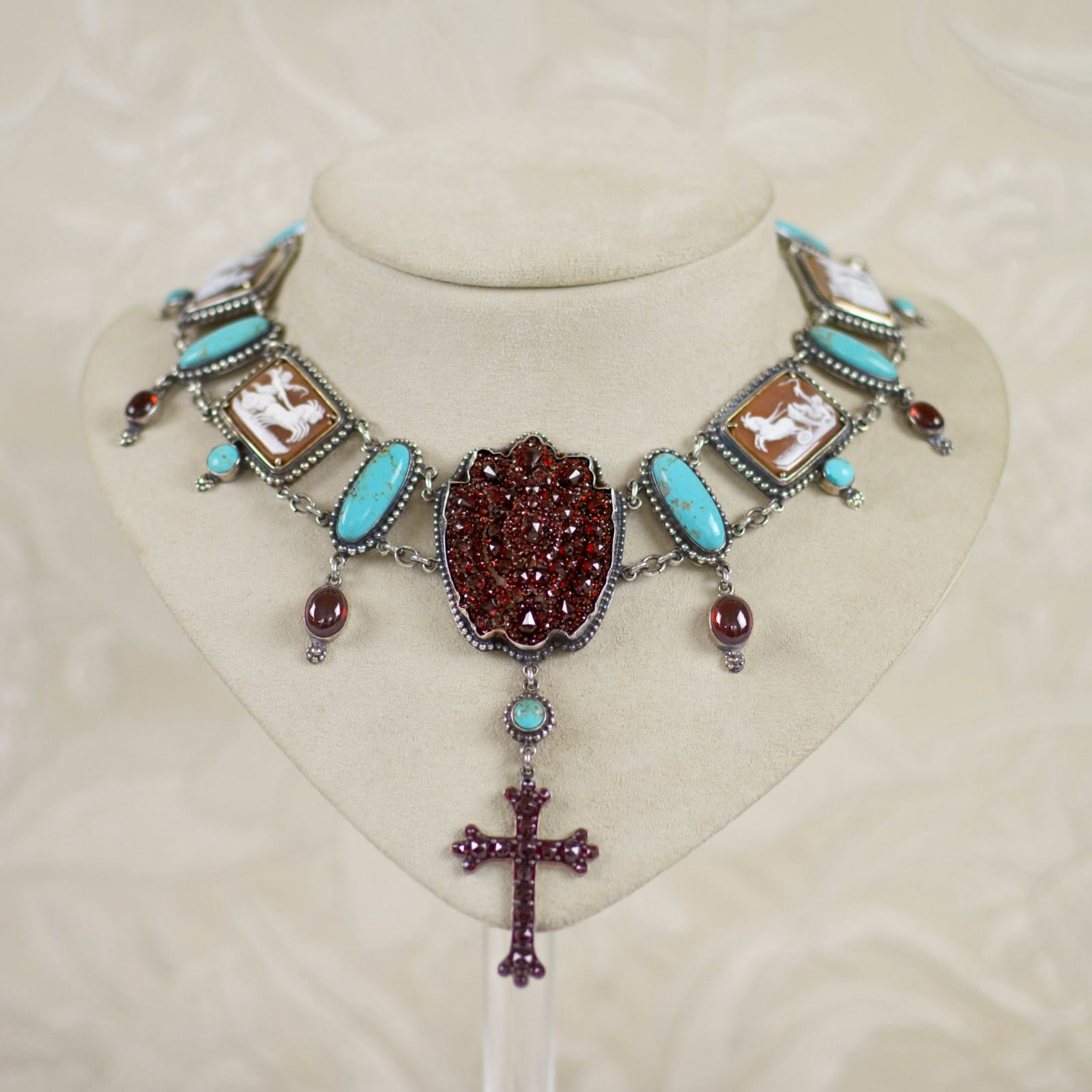 Jill Garber, Very fine natural 19th Century rose cut bohemian garnet locket festoon necklace with a rare collection of hand carved scenic figural cherubim cameos