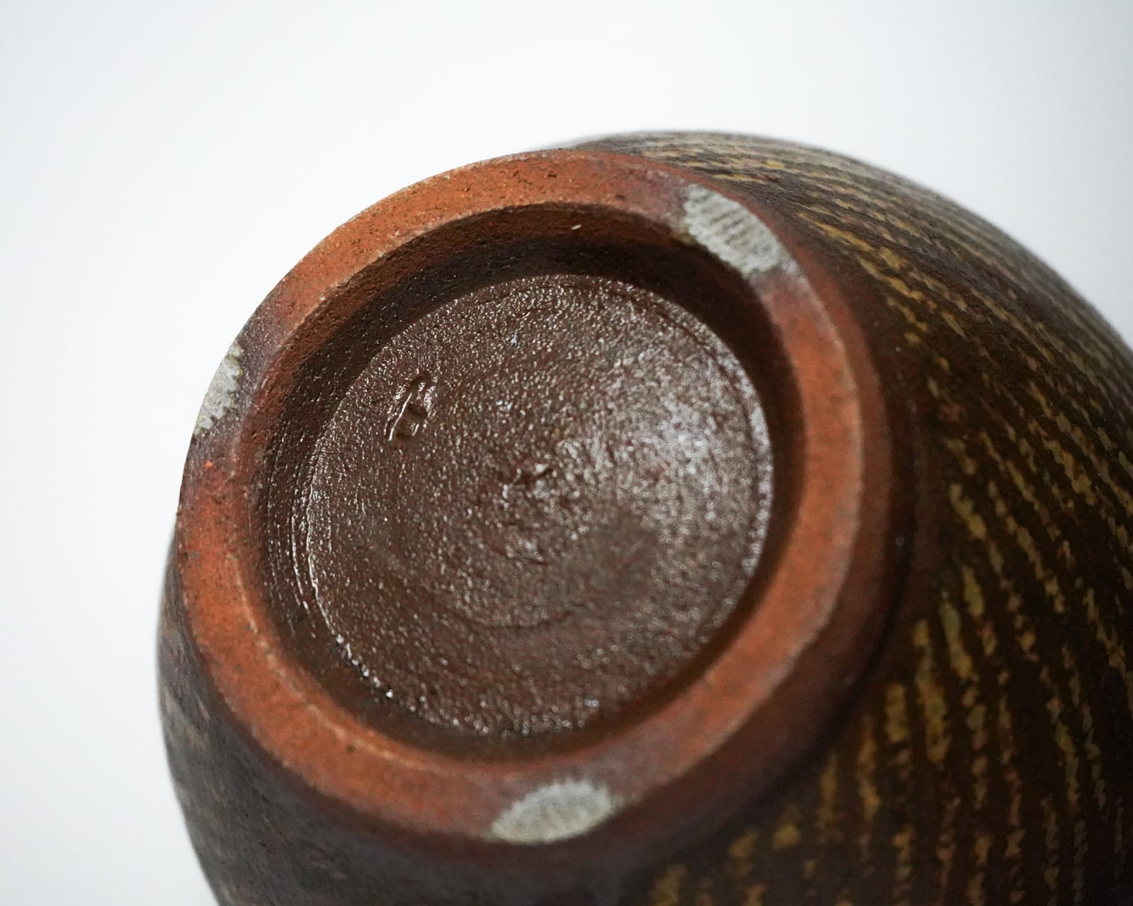 Shimaoka Tatsuzo 島岡達三, Amber glazed water jar on rope impressed inlay