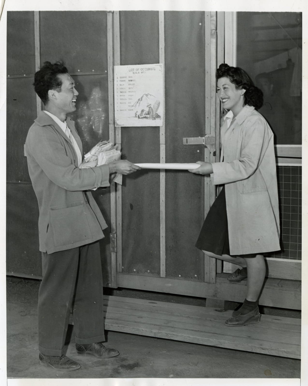 Various photographers including Hikaru Iwasaki, Suite of press photos related to Japanese Internment, 1941-45