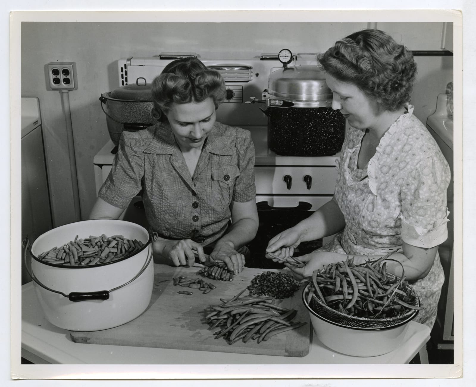 Various Photographers, Large Group of Photos Demonstrating Home-Canning as Part of the "Victory Gardens" War Effort, 1942-44