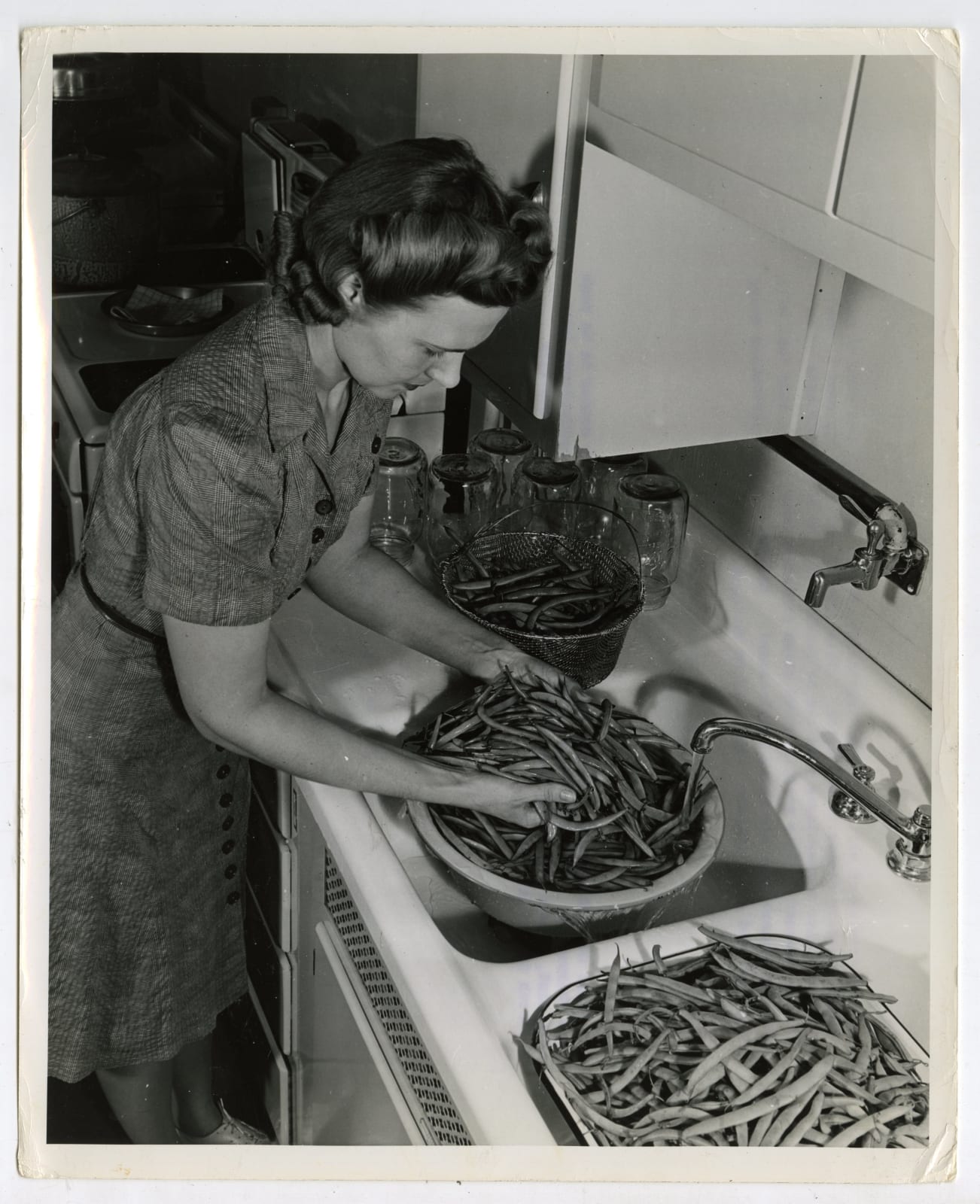Various Photographers, Large Group of Photos Demonstrating Home-Canning as Part of the "Victory Gardens" War Effort, 1942-44