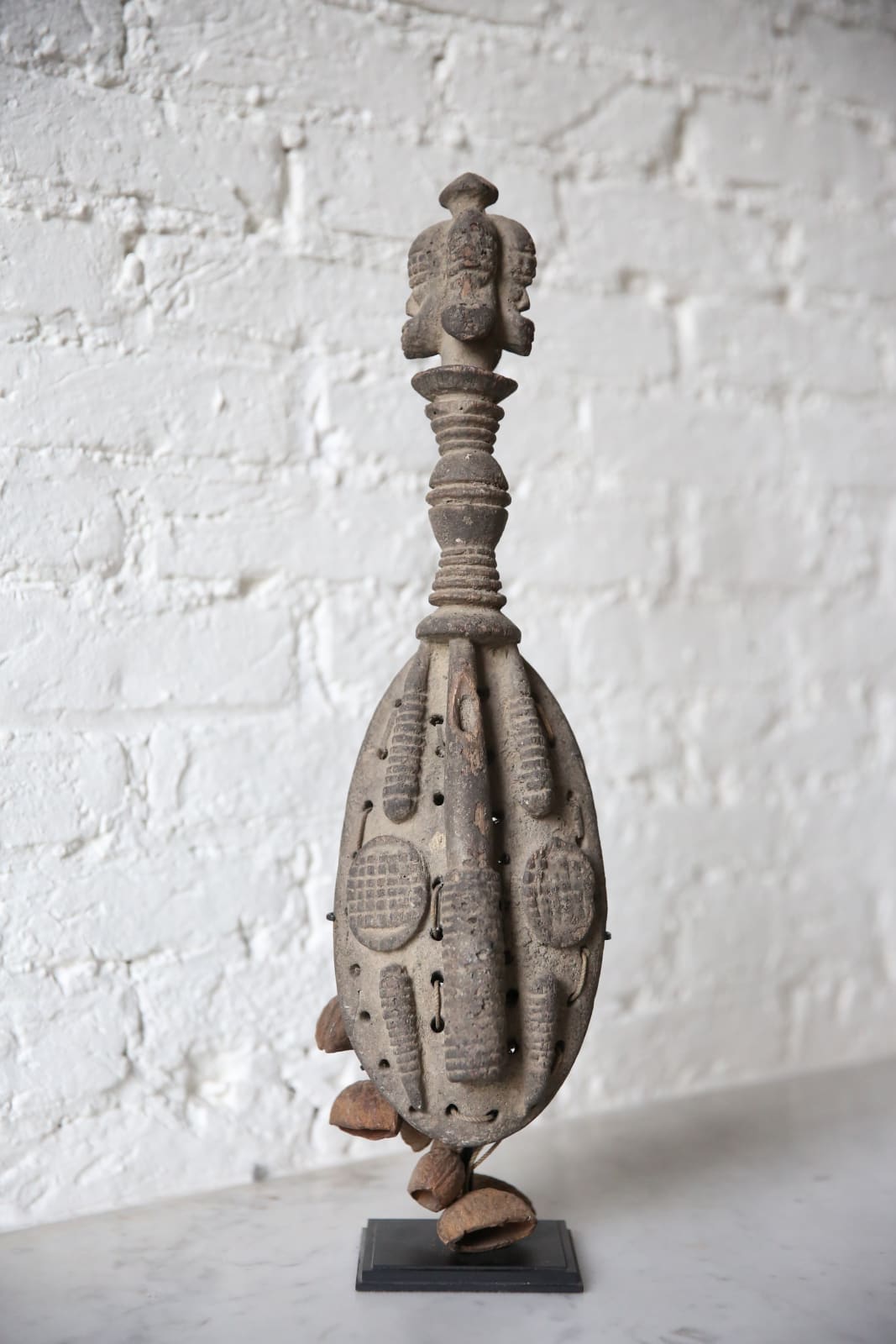 Four-headed Urhobo rattle, Nigeria
