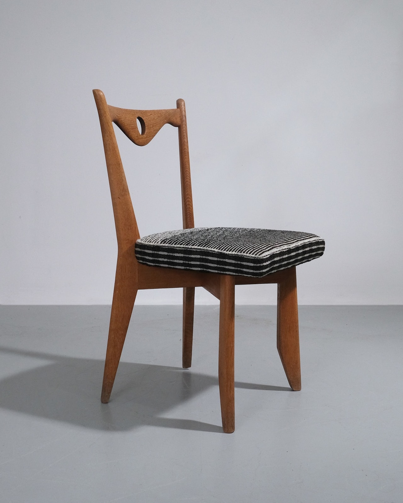 Guillerme et Chambron, Set of Four Dining Chairs With Circular Cut-out Detail