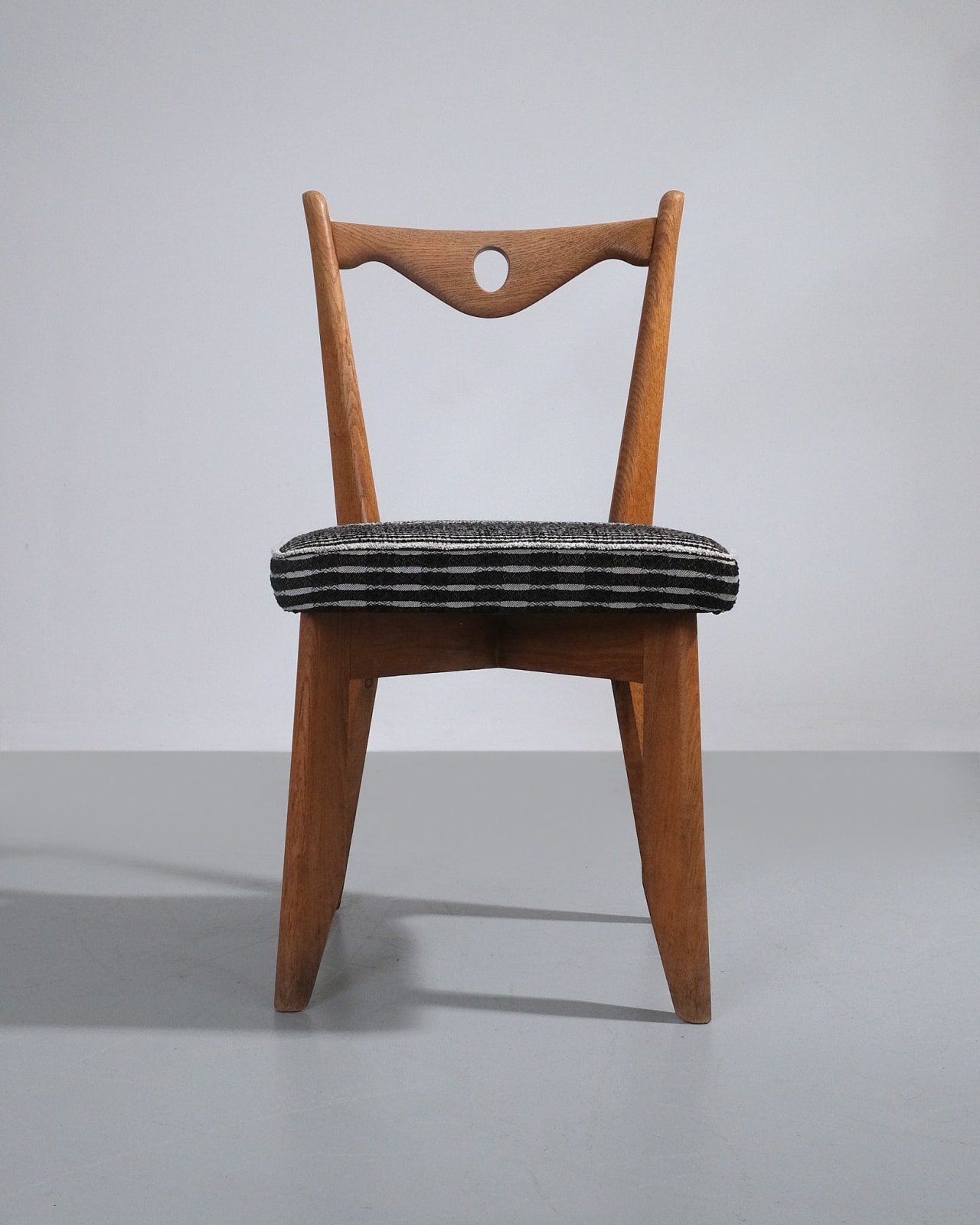 Guillerme et Chambron, Set of Four Dining Chairs With Circular Cut-out Detail