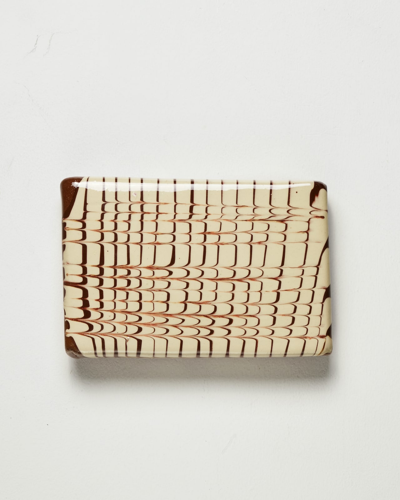 Nicola Tassie, Slip pillow feathering cream slip on terracotta