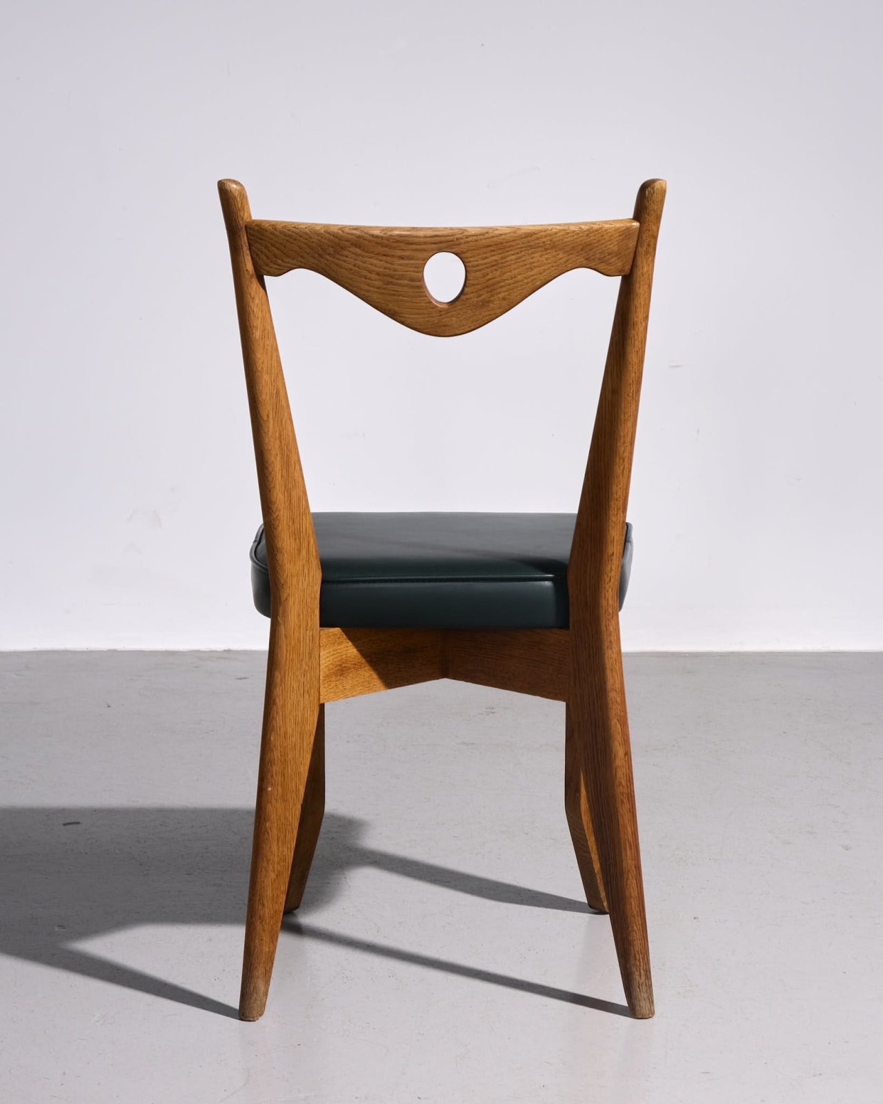 Guillerme et Chambron, Pair of Dining Chairs with circle cut out