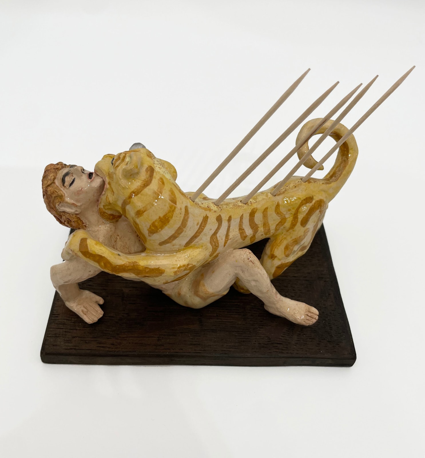 Amata Benedict, Lion Devouring Young Man Toothpick