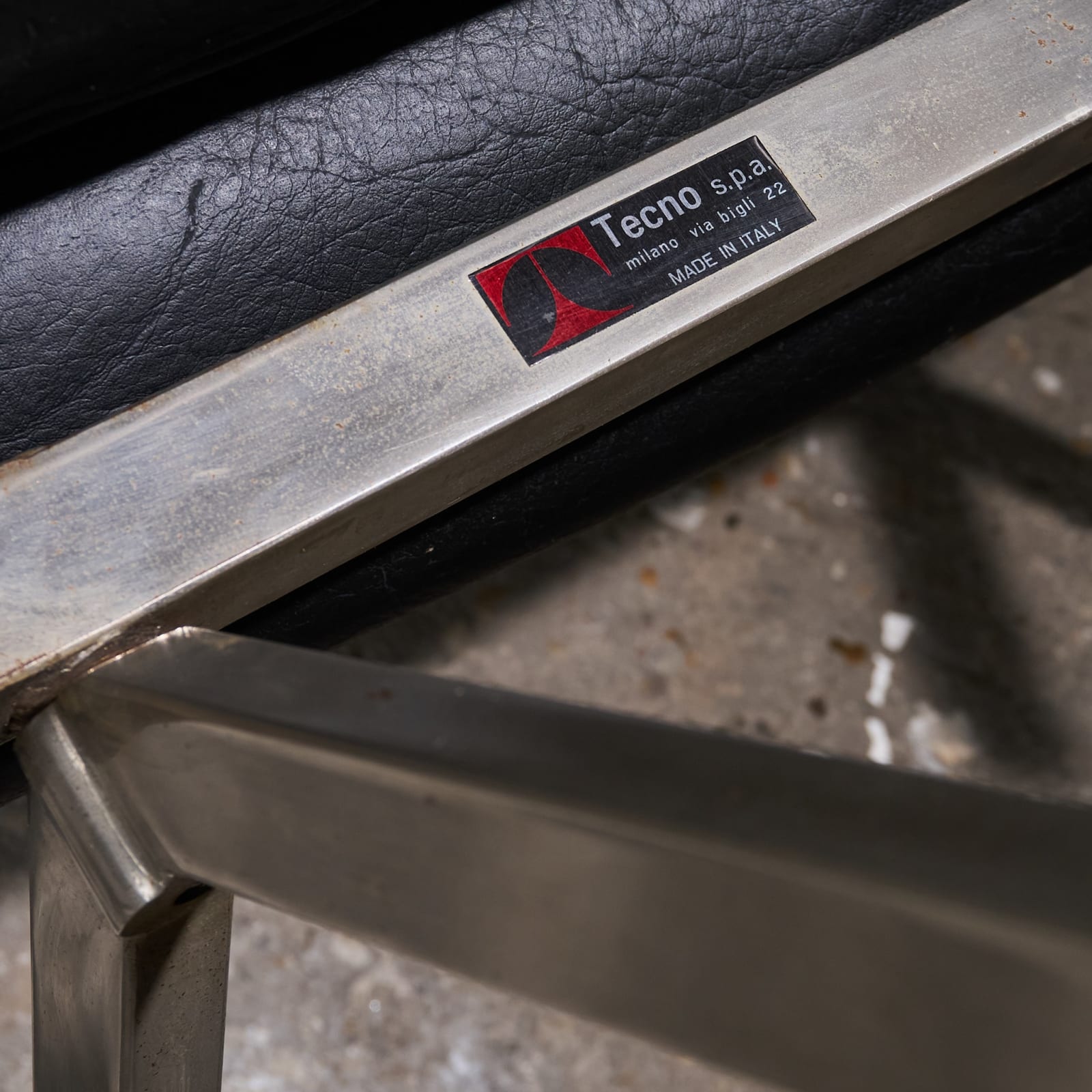 Osvaldo Borsani, 'P40' Lounge Chair in Stainless Steel and Black Faux Leather, Tecno, Italy, 1950s