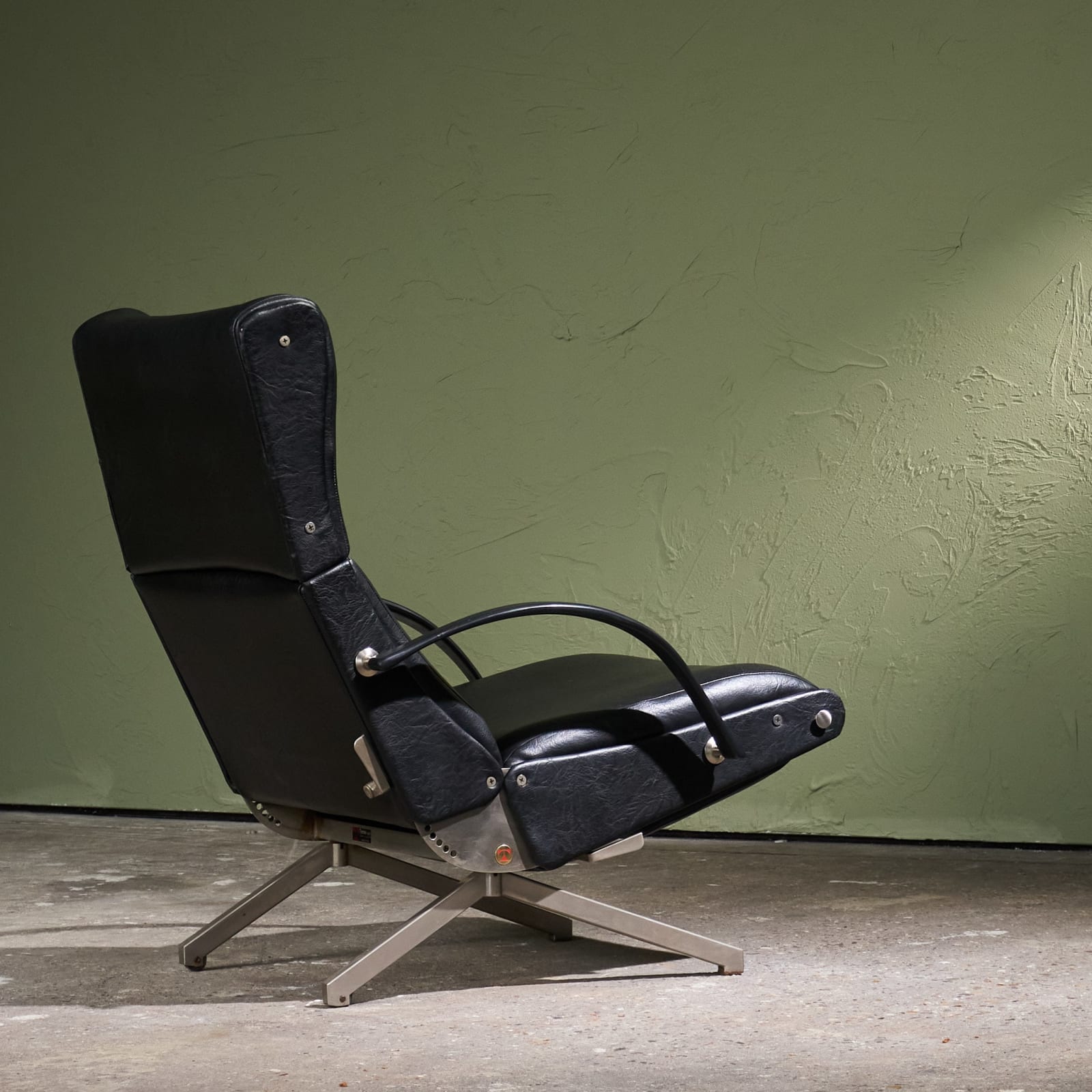 Osvaldo Borsani, 'P40' Lounge Chair in Stainless Steel and Black Faux Leather, Tecno, Italy, 1950s