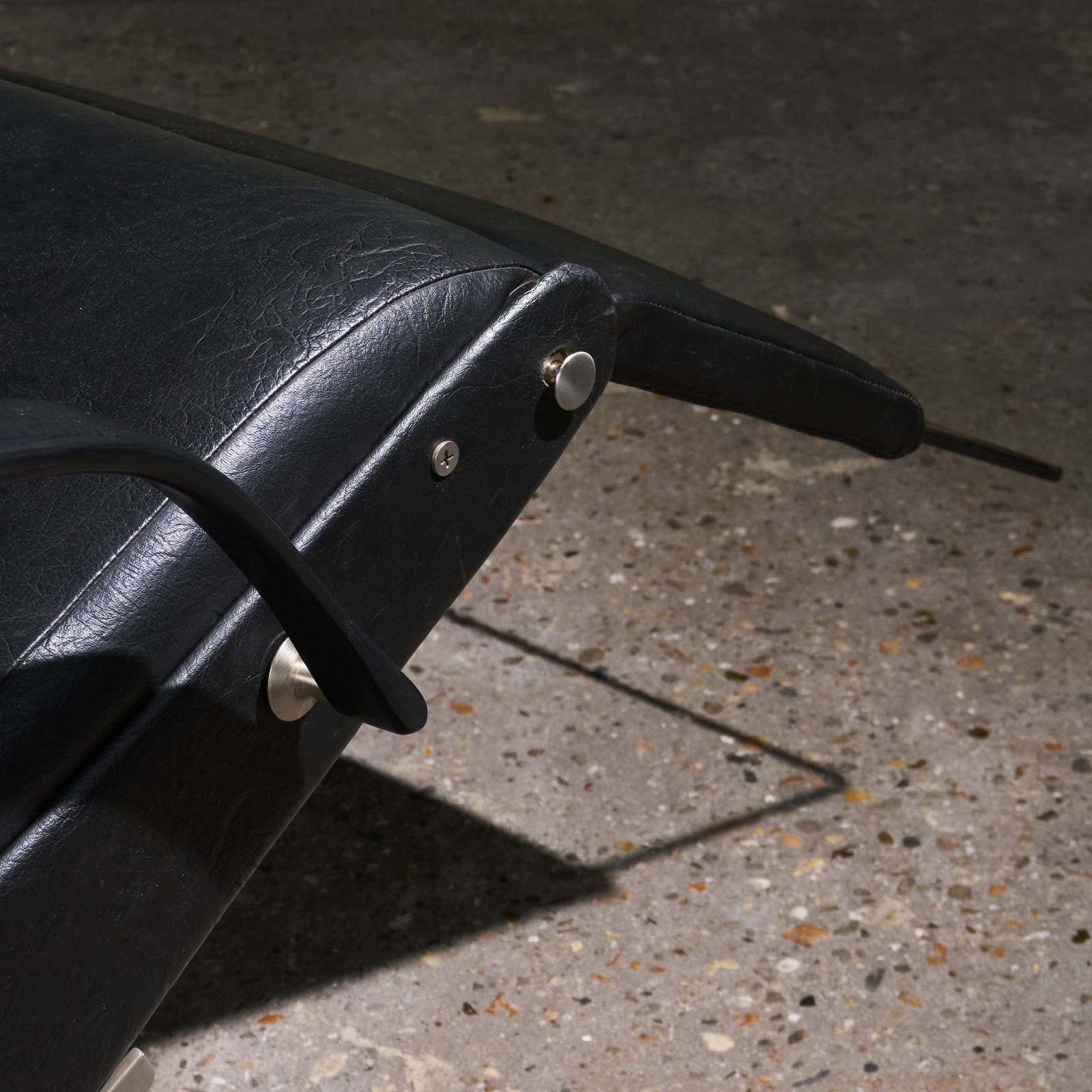 Osvaldo Borsani, 'P40' Lounge Chair in Stainless Steel and Black Faux Leather, Tecno, Italy, 1950s