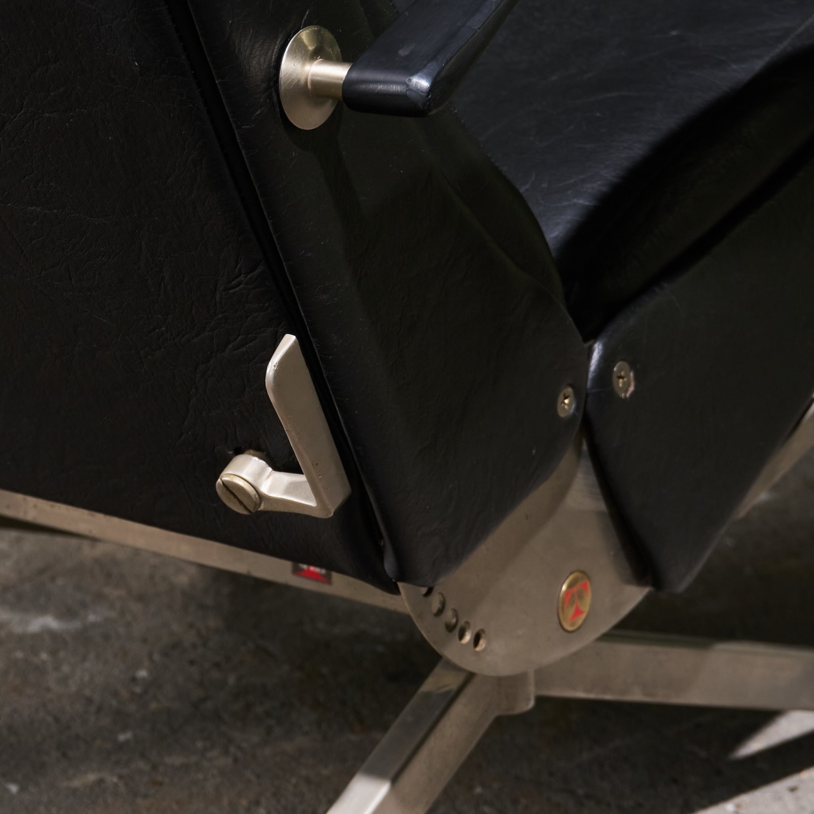 Osvaldo Borsani, 'P40' Lounge Chair in Stainless Steel and Black Faux Leather, Tecno, Italy, 1950s