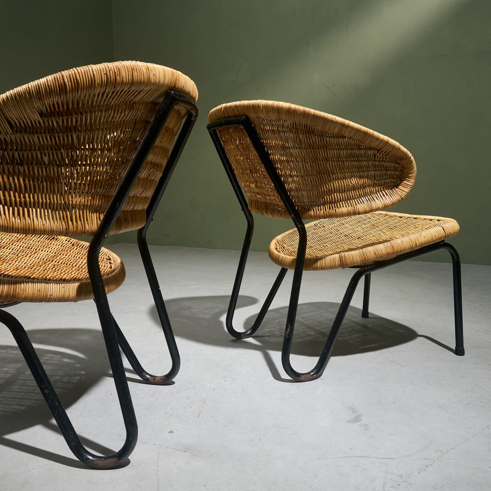 Dirk van Sliedregt, Lounge Chairs in Rattan with Black Tubular Steel frame by Gebroeders Jonkers, The Netherlands, 1960's
