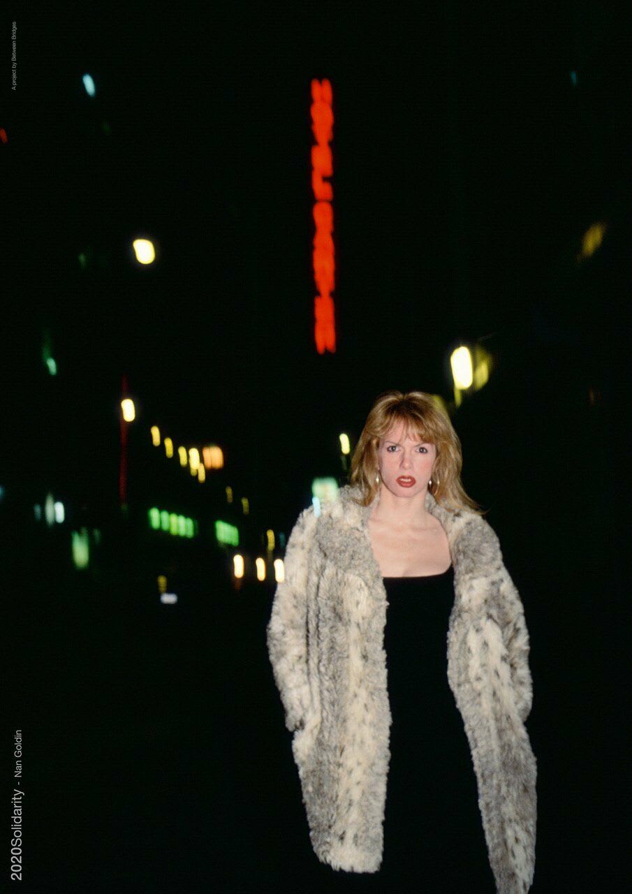 Nan Goldin, Joey in front of the Ambassador Theater, Times Square, NYC (1997), 2020