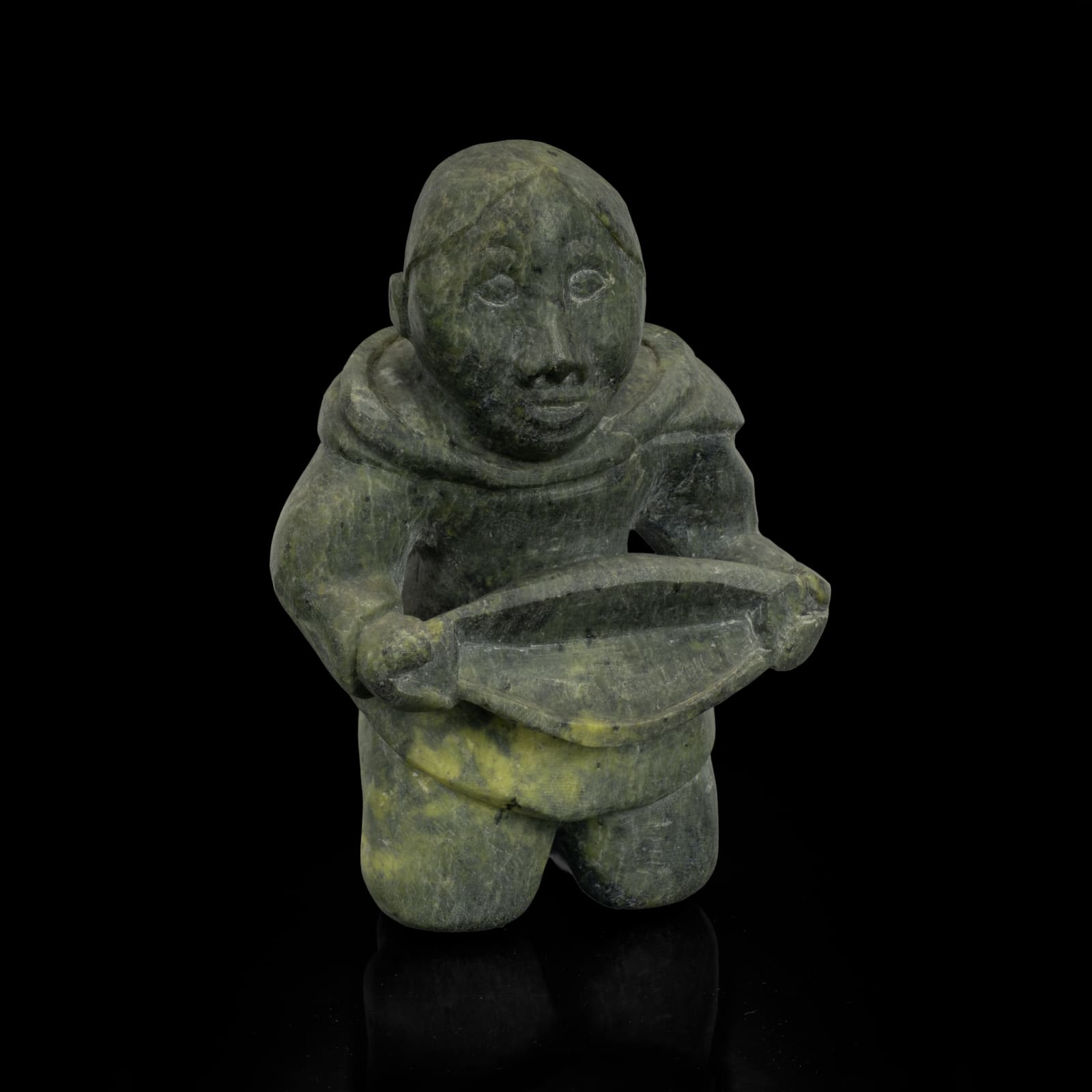 KIAKSHUK (1886-1966) KINNGAIT (CAPE DORSET), Kneeling Woman with Quilliq (Kudlik), c. 1960-63
