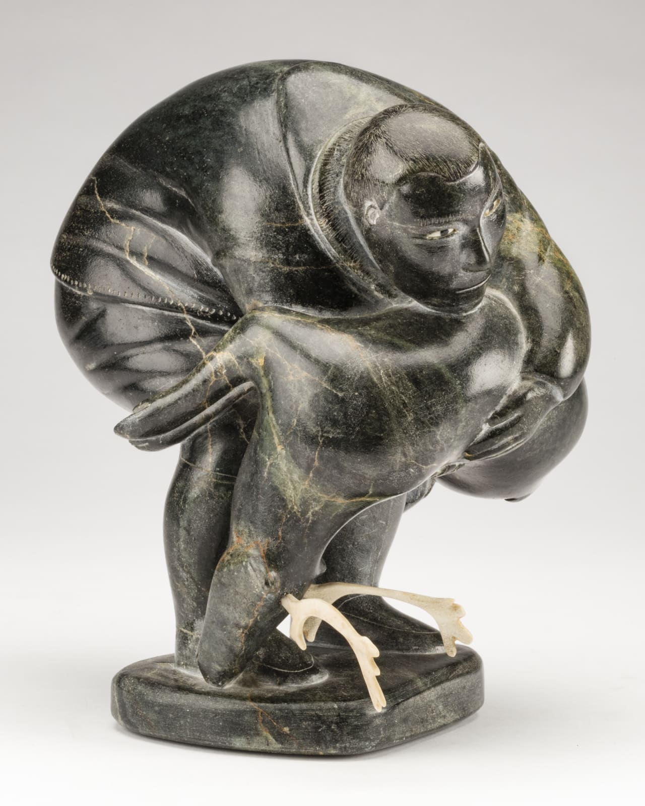 SAMISA PASSAURALU IVILLA (1924-1995) m., PUVIRNITUQ (POVUNGNITUK), Hunter Carrying a Caribou, c. 1958