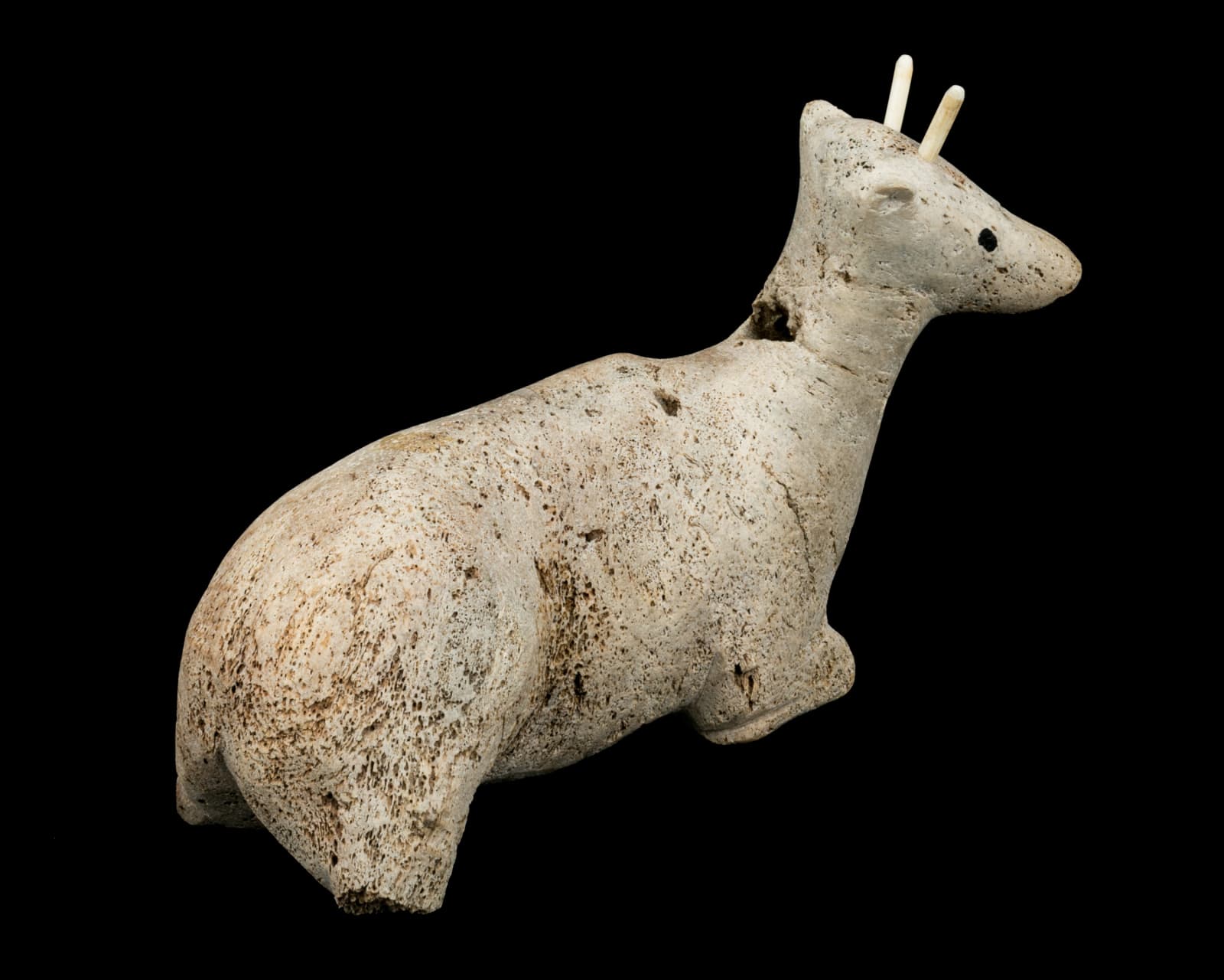 UNIDENTIFIED INUIT ARTIST, POSSIBLY NAUJAAT (REPULSE BAY), Resting Caribou Calf, early 1970s