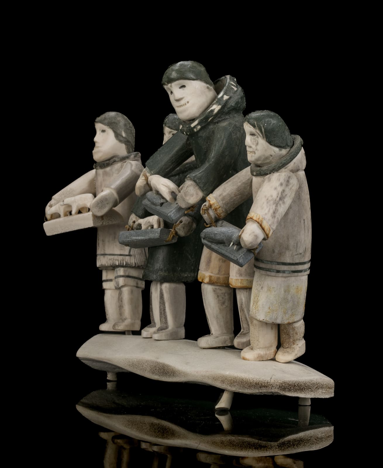 ROMEO EEKERKIK (1923-1983) ARVIAT (ESKIMO POINT), Four Inuit Bringing their Works to the Co-Op, 1975