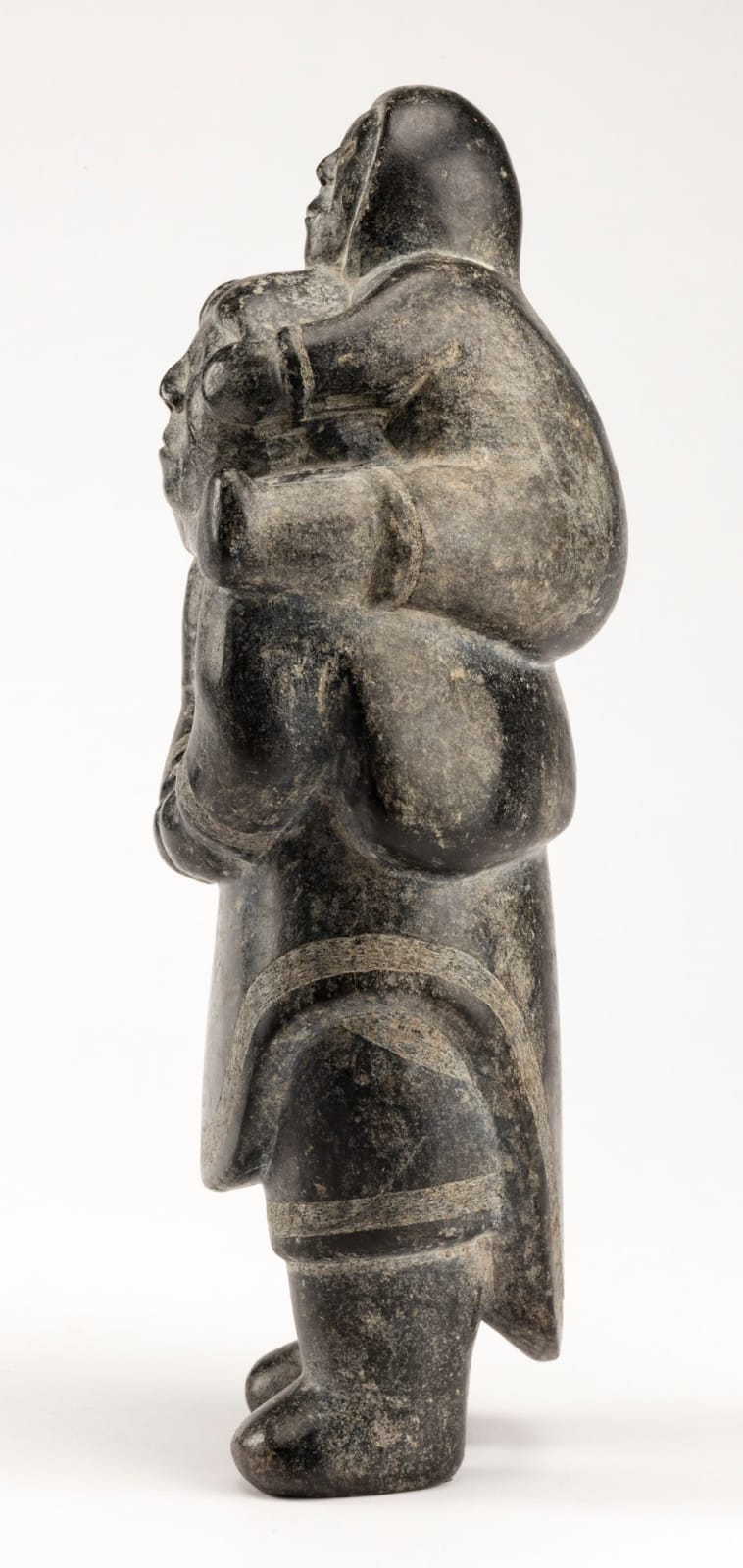 NIVIAQSI (NIVIAKSIAK) (1908-1959) KINNGAIT (CAPE DORSET), Mother with a Child on Her Shoulders, c. 1955