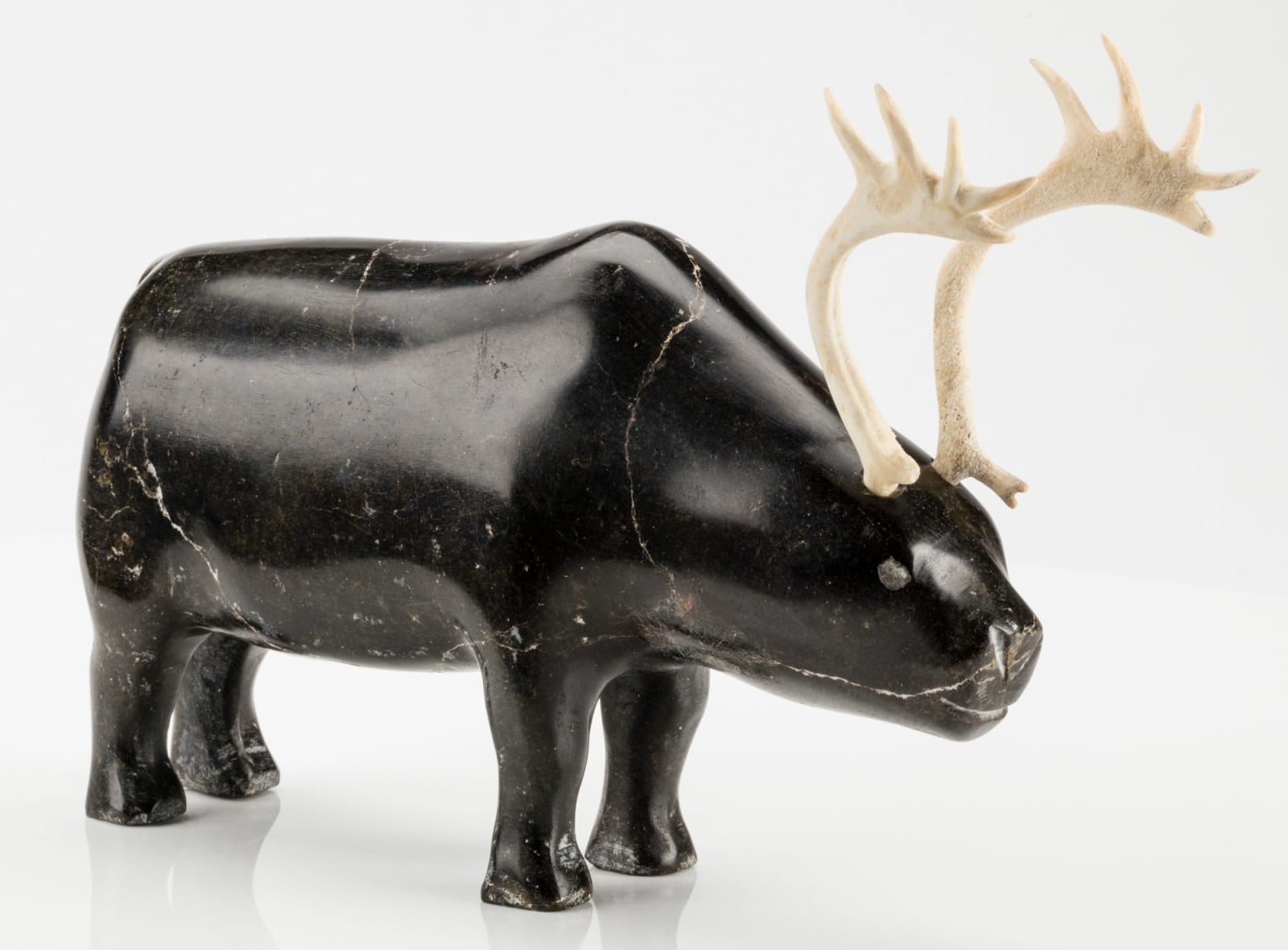 MARK TUNGILIK (1913-1986) NAUJAAT (REPULSE BAY), Standing Caribou, c. mid to late 1970s