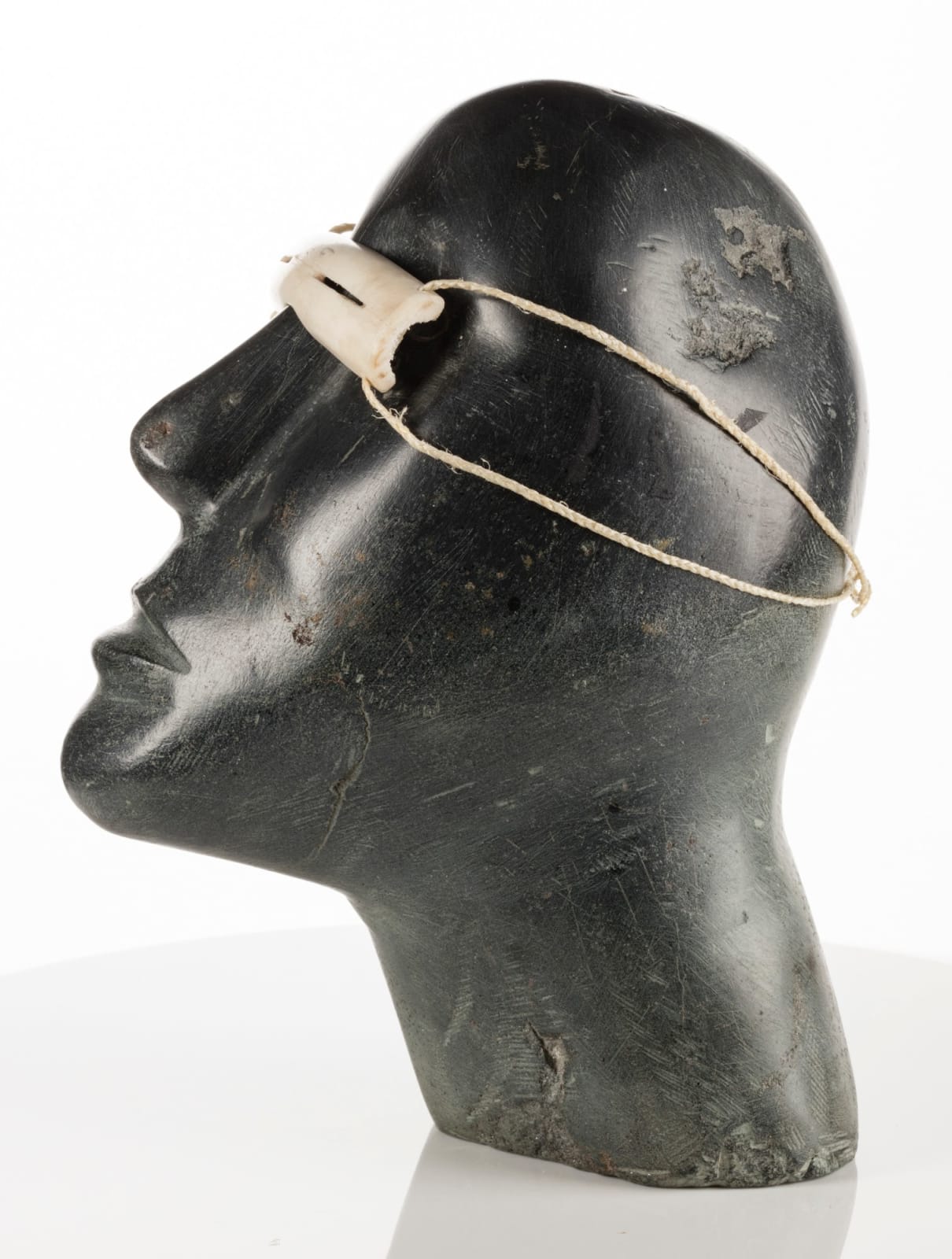 MOSES NAGYUGALIK (1910-1996) QAMANI’TUAQ (BAKER LAKE), Head of a Man Wearing Snow Goggles, 1968