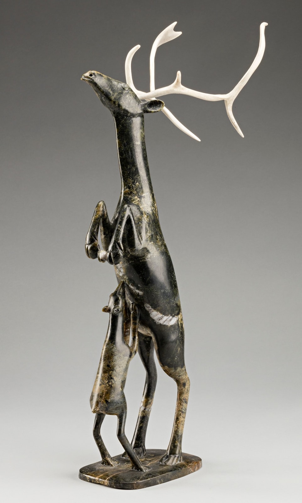 OSUITOK IPEELEE, R.C.A. (1922 or 1923-2005) KINNGAIT (CAPE DORSET, Rearing Caribou with Nursing Calf, 1994