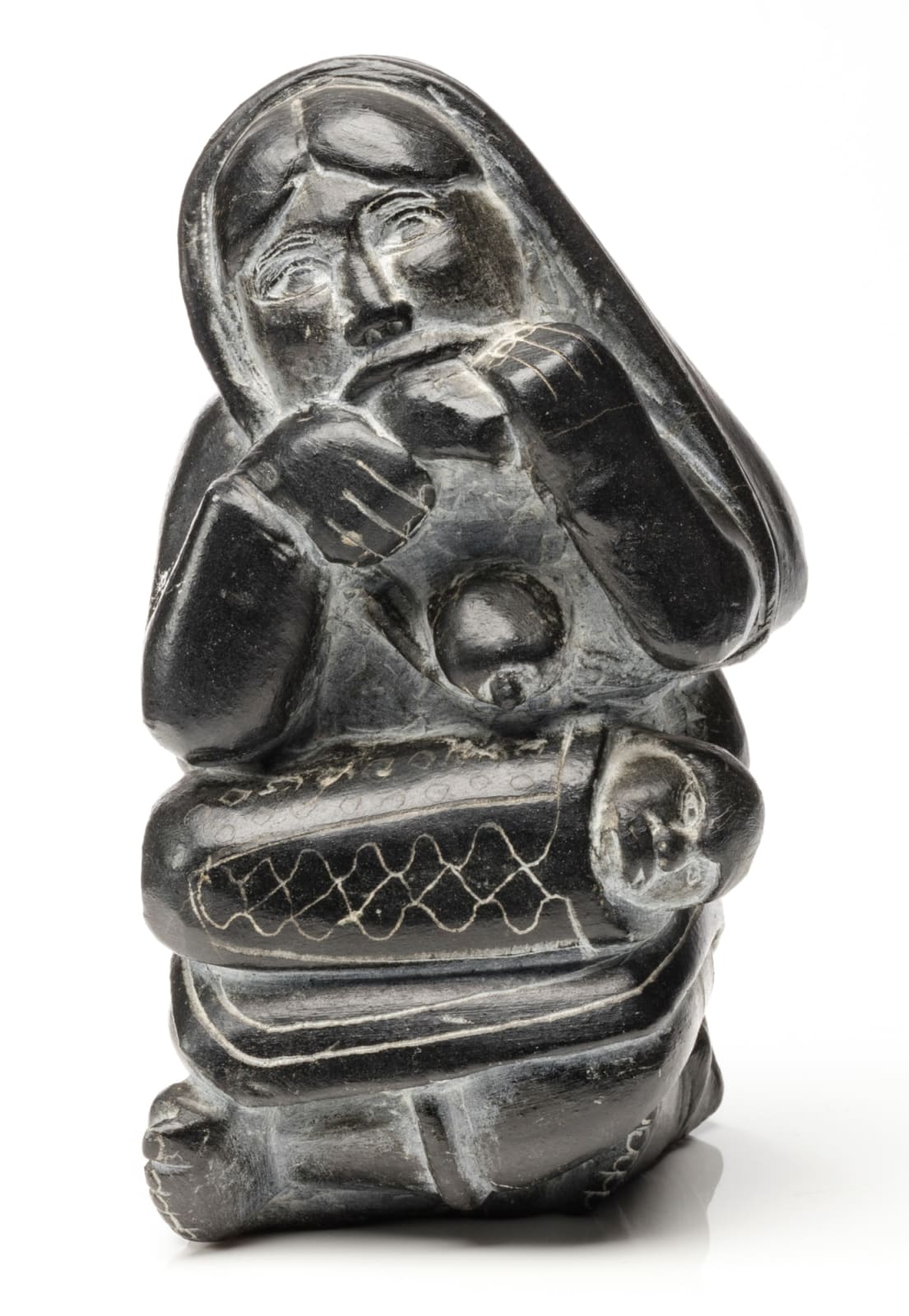 DAVIDIALUK ALASUA AMITTU (1910-1976) PUVIRNITUQ (POVUNGNITUK), Seated Mother Softening a Skin, c. 1960