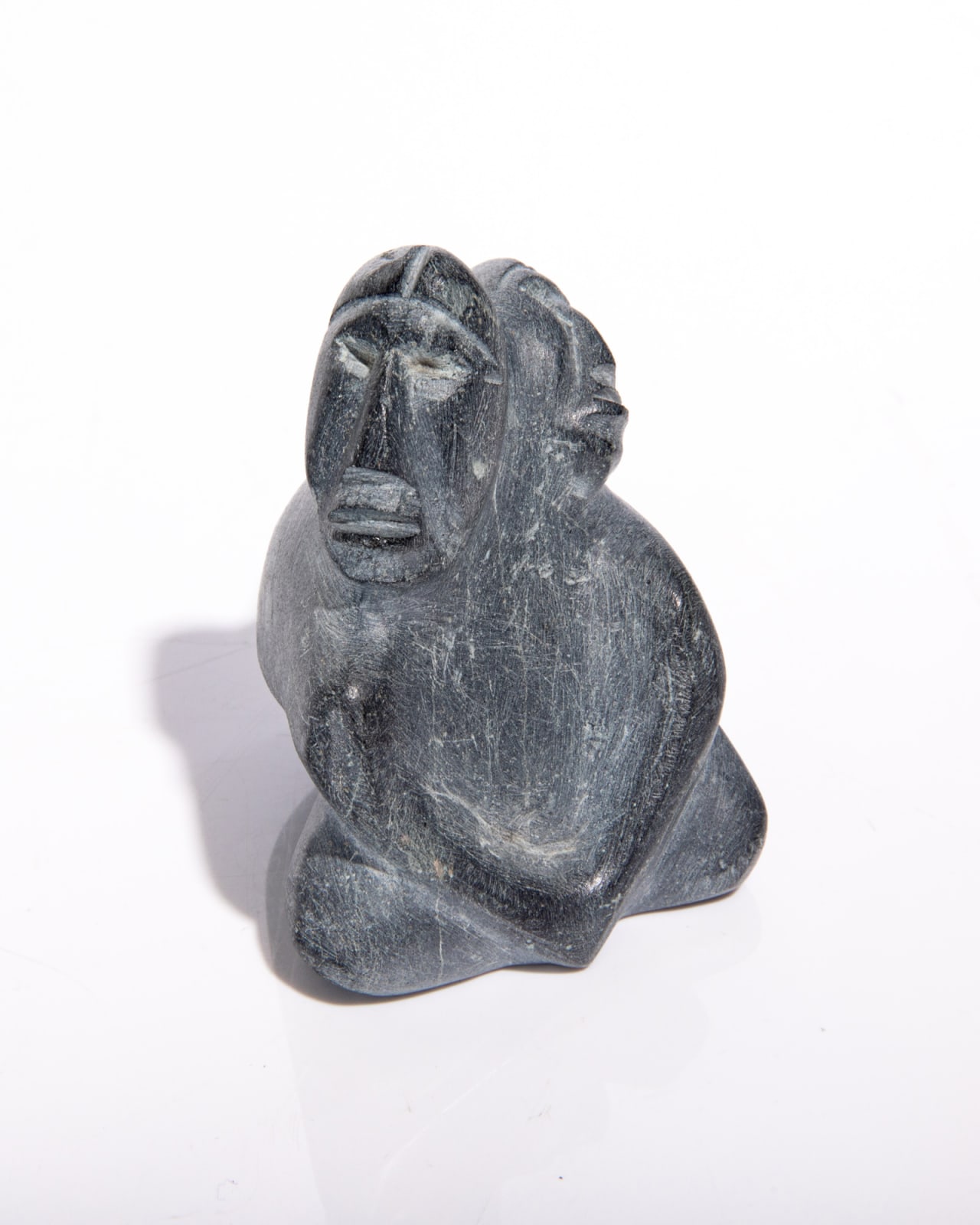 JOY KILUVIGYUAK HALLAUK (1940-2000) ARVIAT (ESKIMO POINT), Seated Mother with Child in her Amaut