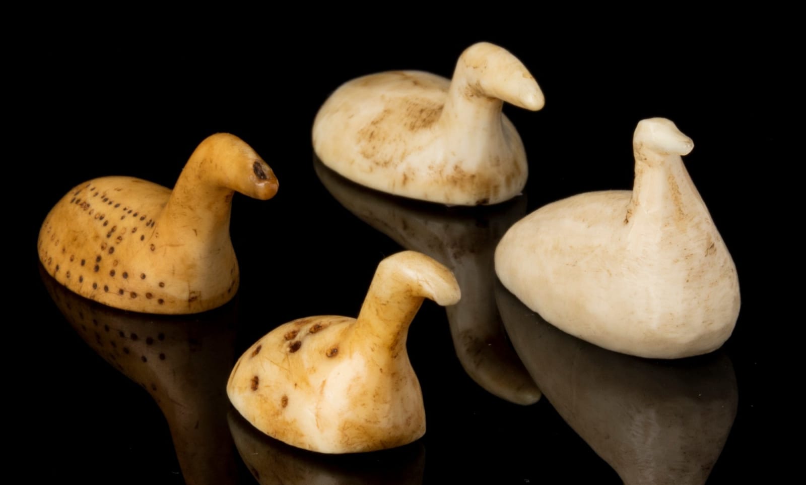 INUIT AND POSSIBLY THULE CULTURE MAKERS, EASTERN CANADIAN ARCTIC, Four Bird Game Pieces, before 1935