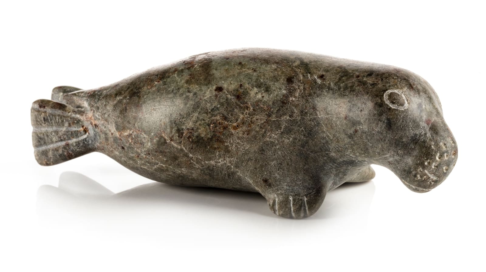 KENOJUAK ASHEVAK, C.C., R.C.A. (1927-2013) KINNGAIT (CAPE DORSET), Man with Qulliq, and Seal, 1964