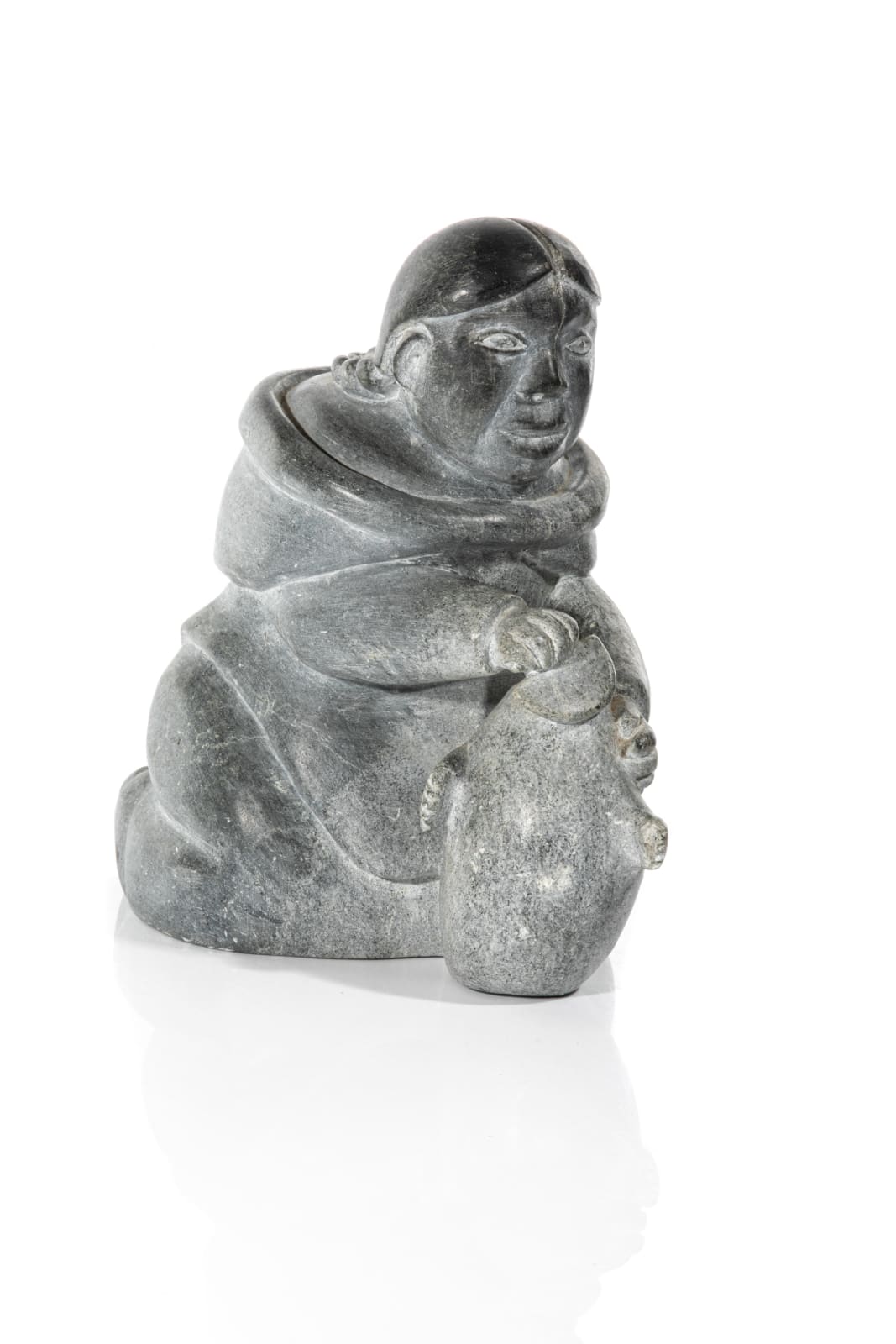 SARAH MEEKO NASTAPOKA (1925-) INUKJUAK (PORT HARRISON), A Kneeling Woman Preparing a Skin