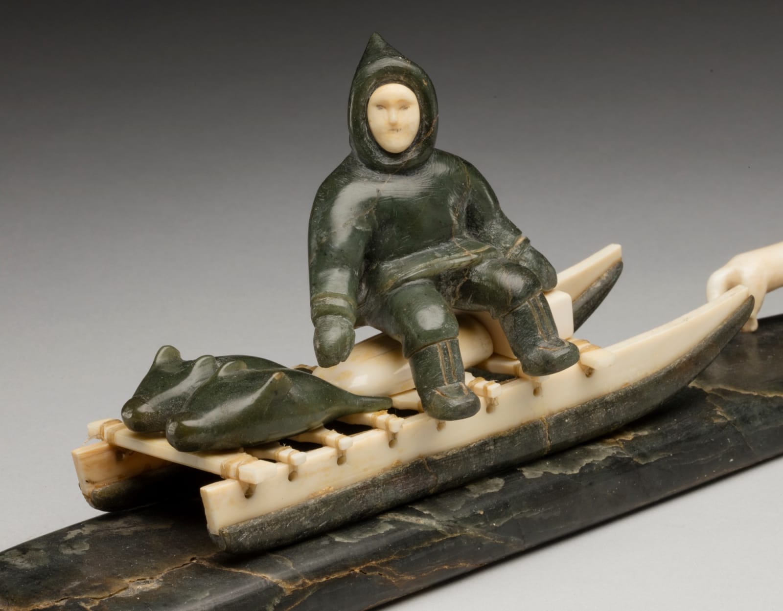 UNIDENTIFIED ARTIST, INUKJUAK (PORT HARRISON), Hunter Seated on a Qamutiq (Dog Sled), early-mid 1950s